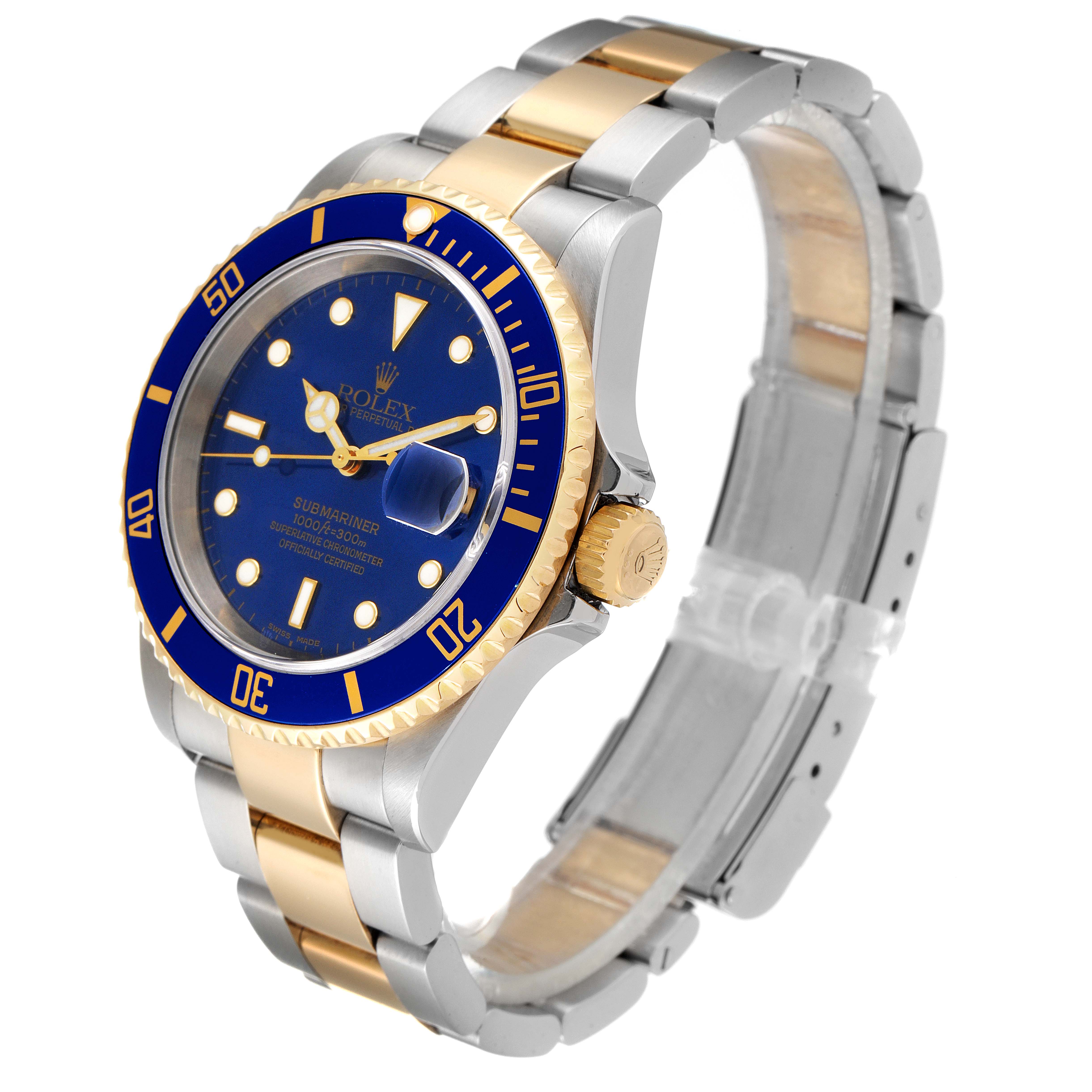 The image shows a Rolex Submariner 16613 Men
s Steel and Gold (two tone) Blue Dial 16613 Men
s Steel and Gold (two tone) Blue Dial watch at a three-quarter angle, highlighting its blue dial, bezel, and two-tone bracelet.