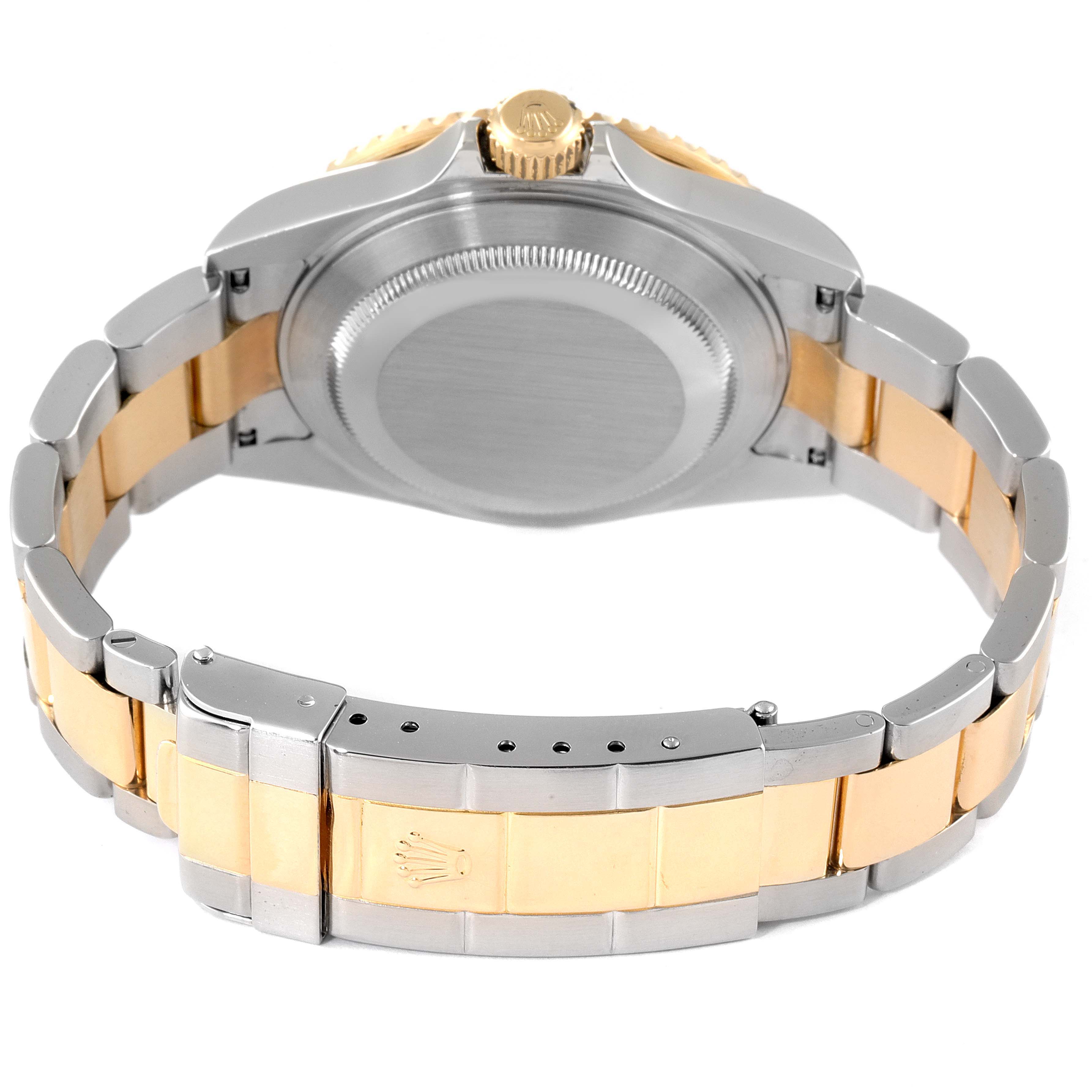 The image shows the back case and bracelet of the Rolex Submariner 16613 Men
s Steel and Gold (two tone) Blue Dial 16613 Men
s Steel and Gold (two tone) Blue Dial watch, focusing on the clasp and crown.