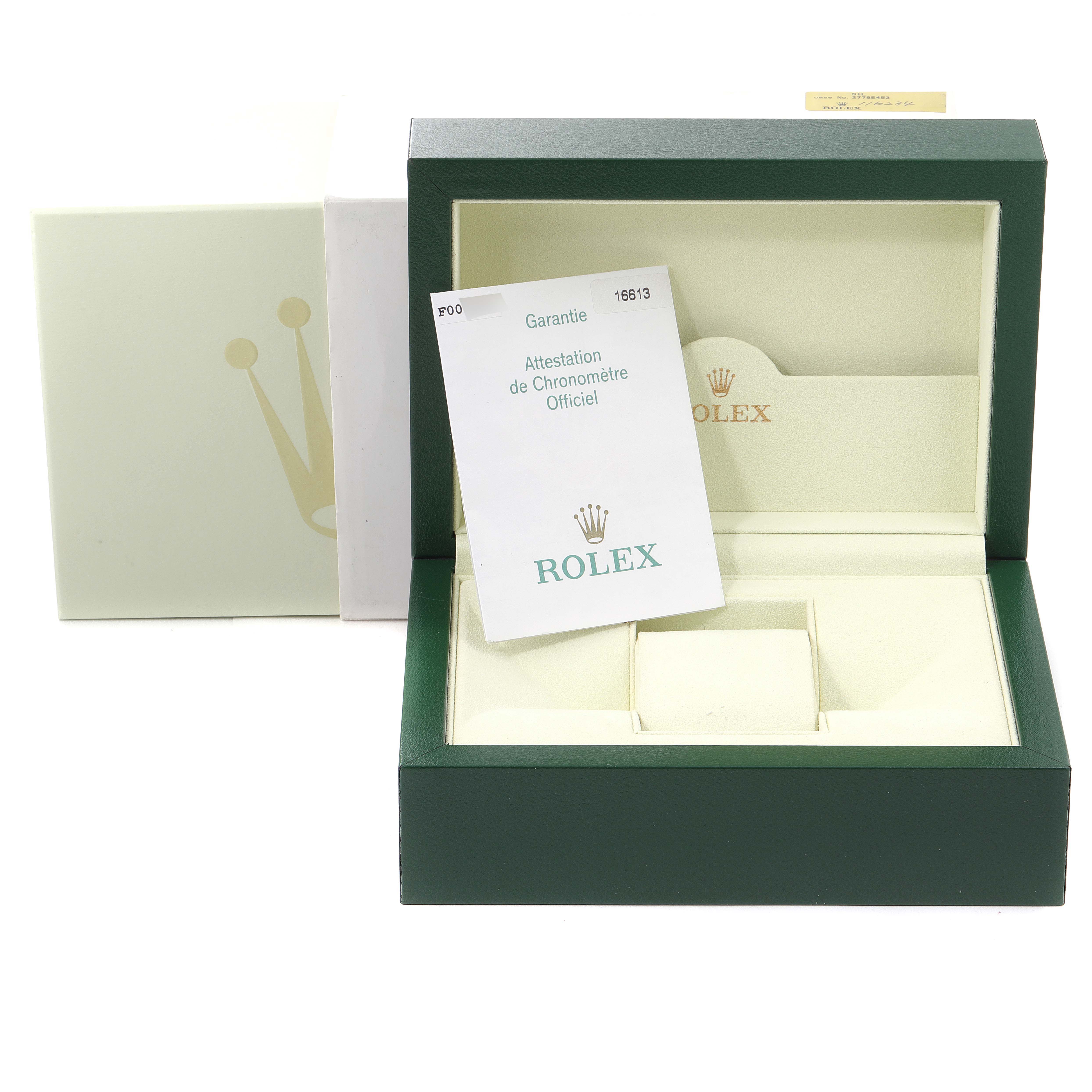 This image shows the packaging and warranty card for a Rolex Submariner 16613 Men
s Steel and Gold (two tone) Blue Dial 16613 Men
s Steel and Gold (two tone) Blue Dial, including the outer box and inner display case.