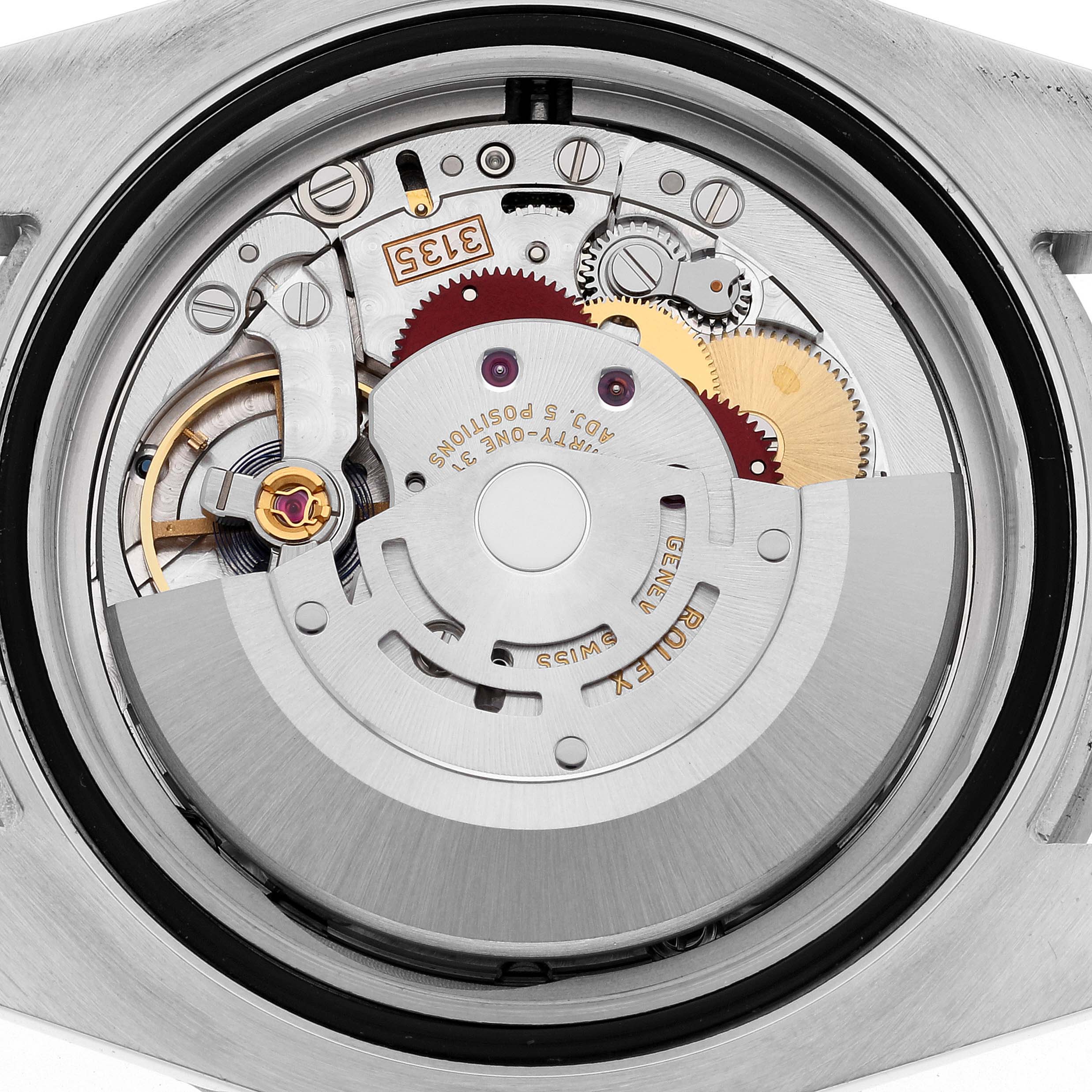 The image shows the internal mechanism of a Rolex Submariner 116610LV Men's Stainless Steel Green Dial 116610LV Men's Stainless Steel Green Dial watch from a rear angle with its case back removed.