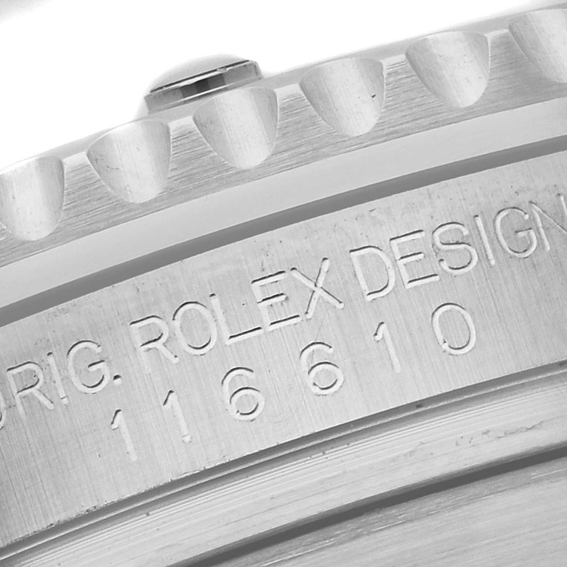The image shows a macro close-up of the case side of a Rolex Submariner 116610LV Men's Stainless Steel Green Dial 116610LV Men's Stainless Steel Green Dial, displaying the engraved model number 116610.