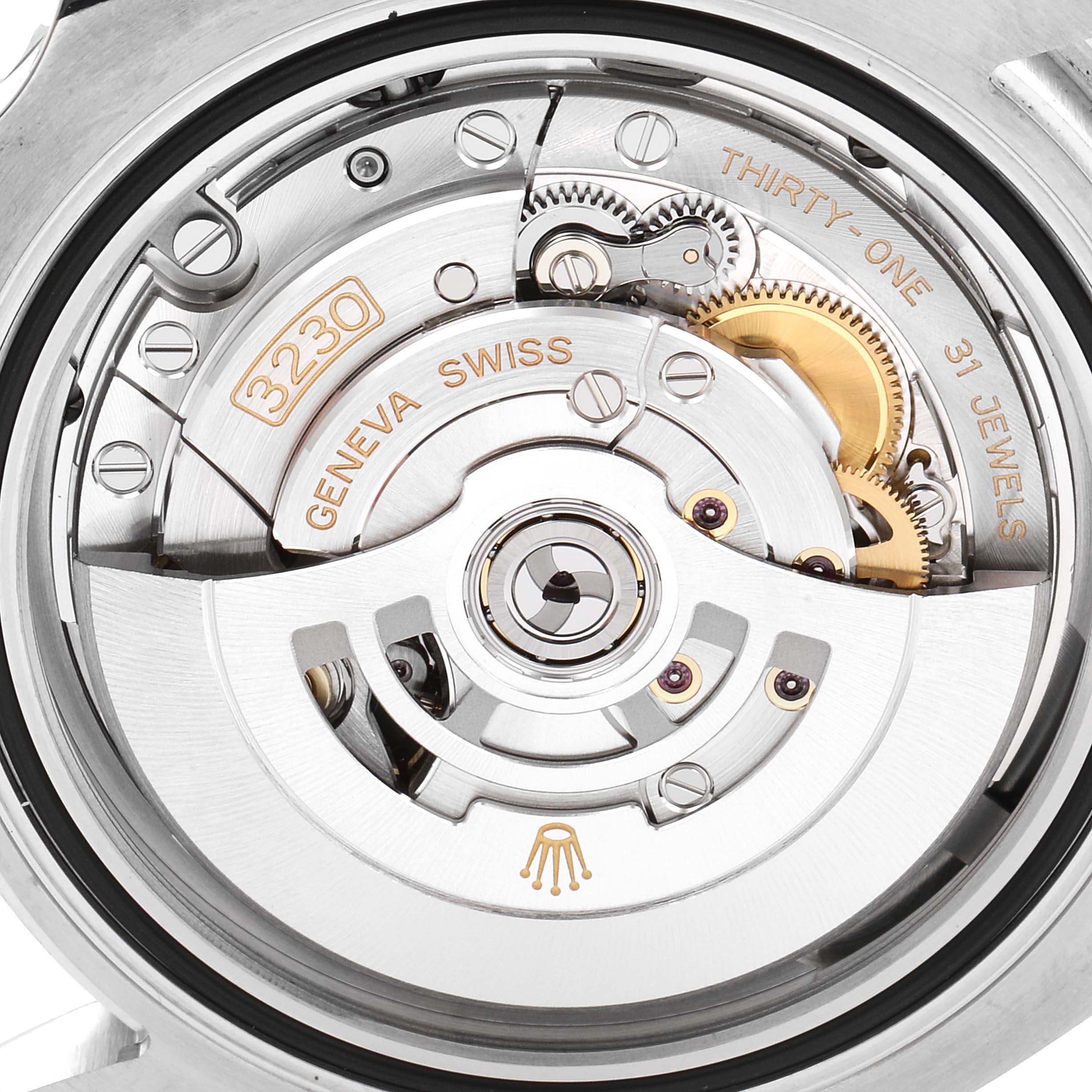 The image shows a close-up of the movement mechanism of a Rolex Submariner 124060 Men's Stainless Steel Black Dial 124060 Men's Stainless Steel Black Dial watch, highlighting the intricate parts and engravings.
