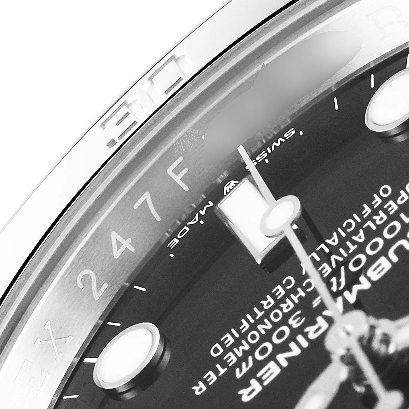 Close-up angle of the dial and bezel of a Rolex Submariner 124060 Men's Stainless Steel Black Dial 124060 Men's Stainless Steel Black Dial, showing the text and part of the hands.