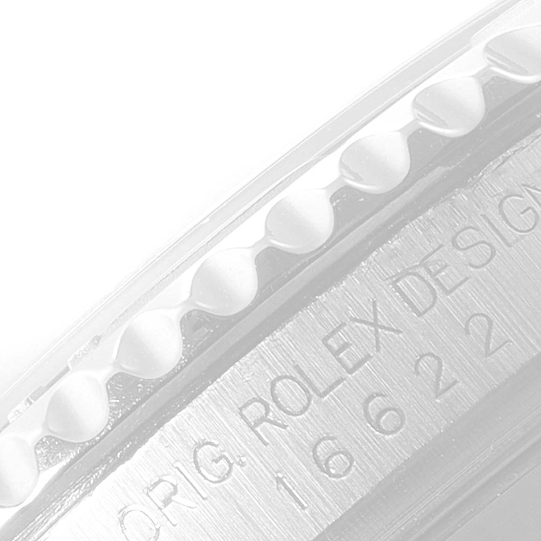 This close-up shows the side engraving and part of the bezel of a Rolex Yacht-Master 16622 Men's Stainless Steel Silver Dial 16622 Men's Stainless Steel Silver Dial watch.