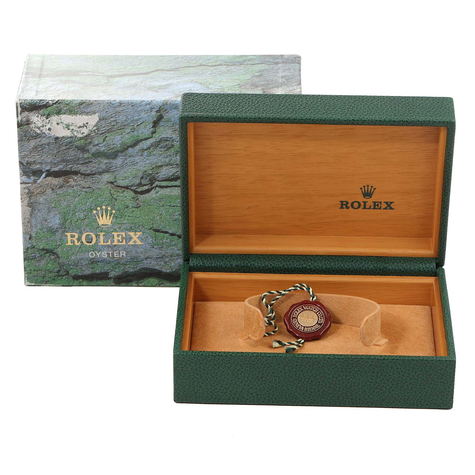 This image shows an open green Rolex box with a Yacht-Master tag inside, along with the outer packaging box behind it.