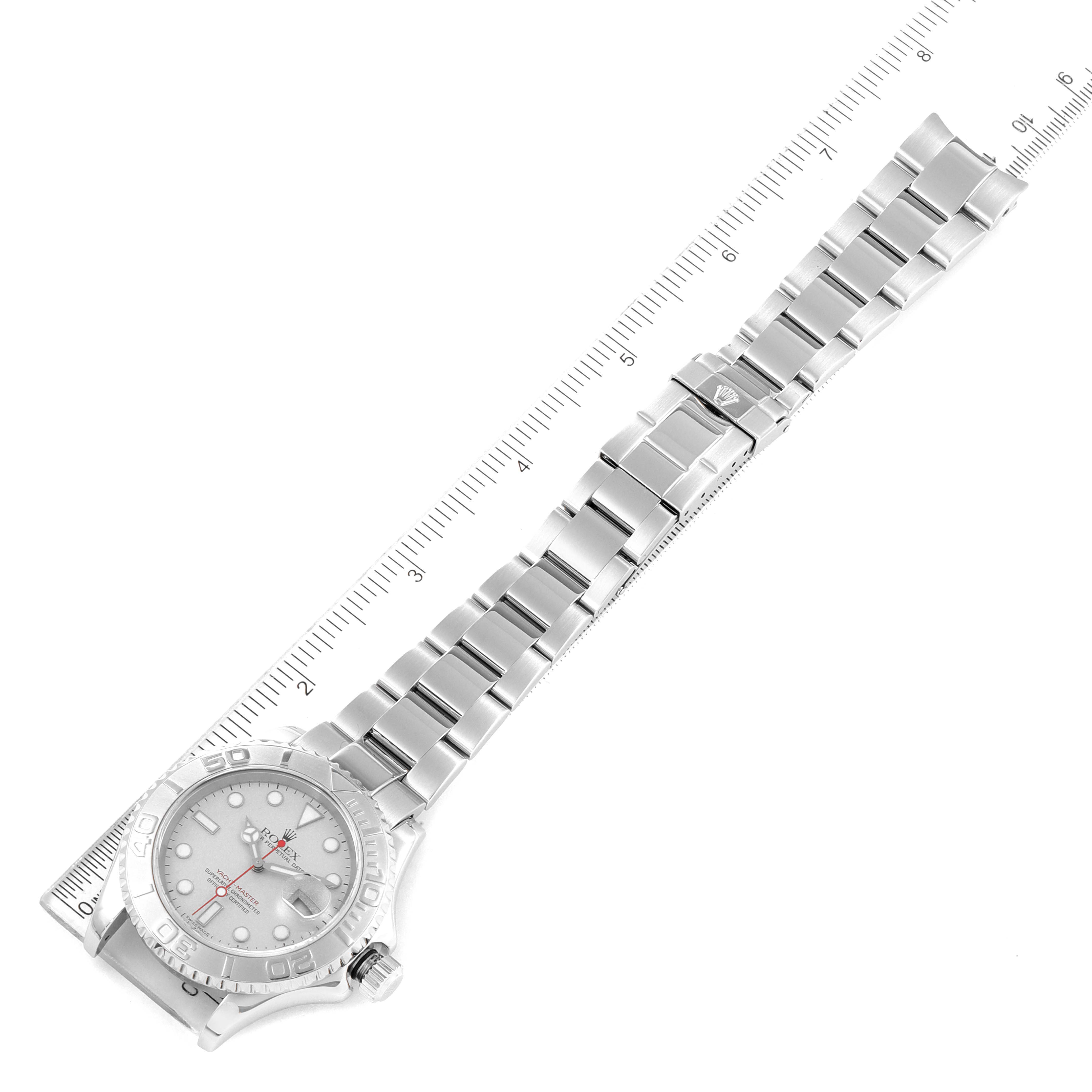 The image shows a Rolex Yacht-Master 16622 Men's Stainless Steel Silver Dial 16622 Men's Stainless Steel Silver Dial watch laid flat with its bracelet extended beside a ruler for size reference.