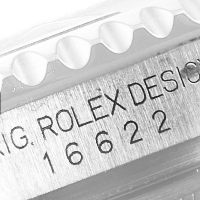 The image shows an extreme close-up of the engravings on the side of a Rolex Yacht-Master 16622 Men's Stainless Steel Silver Dial 16622 Men's Stainless Steel Silver Dial watch bezel.