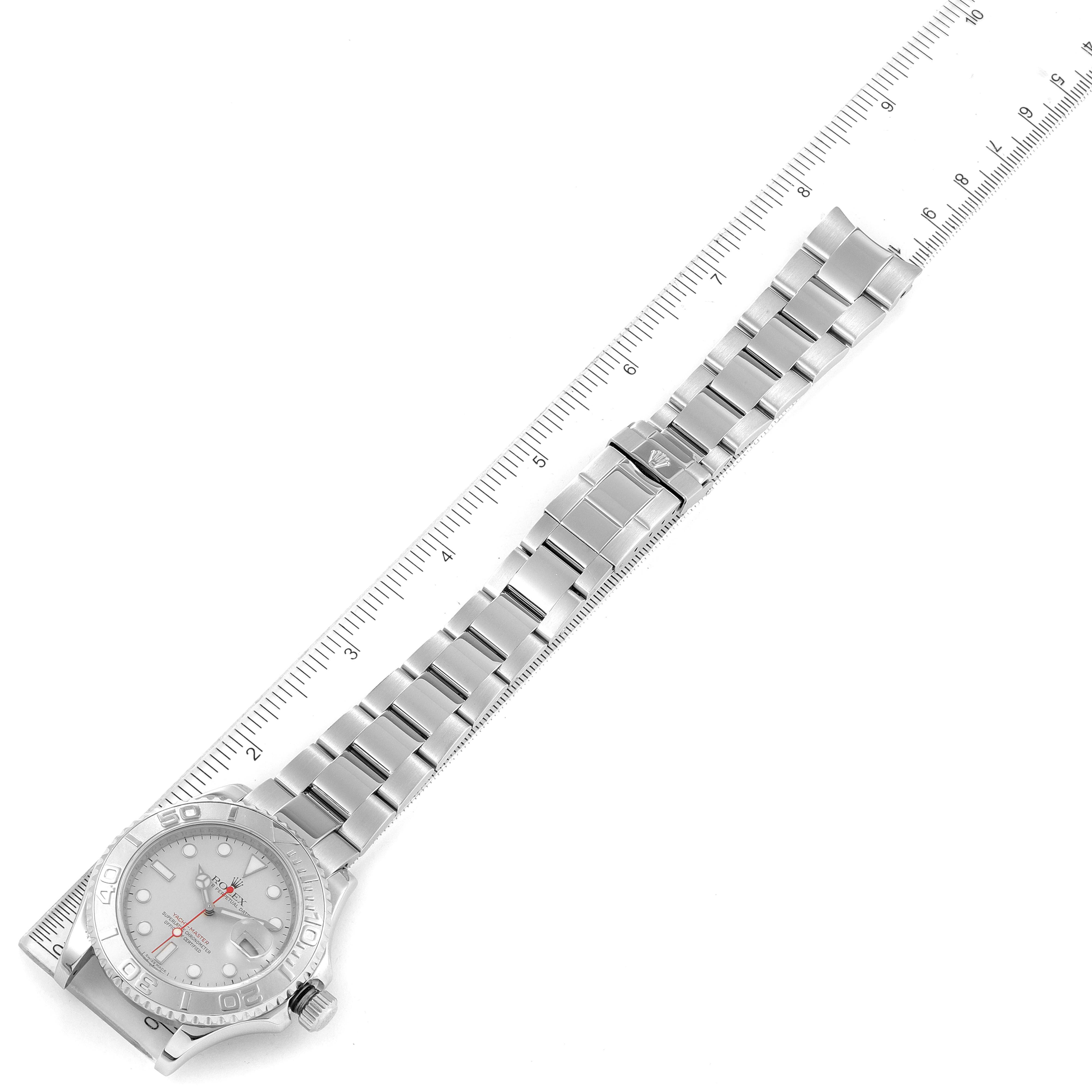 The image shows the Rolex Yacht-Master 16622 Men's Stainless Steel Silver Dial 16622 Men's Stainless Steel Silver Dial watch laid flat with a ruler measuring its entire length, including the bracelet and watch face.