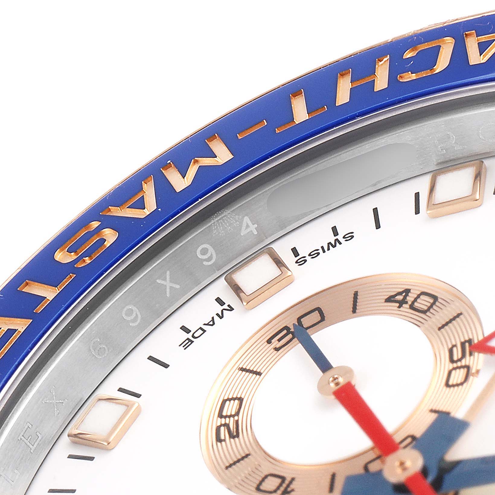 The image shows a close-up of the bezel and part of the dial on a Rolex Yacht-Master 116681 Men's Rose Gold White Dial 116681 Men's Rose Gold White Dial watch, highlighting the brand and model name.