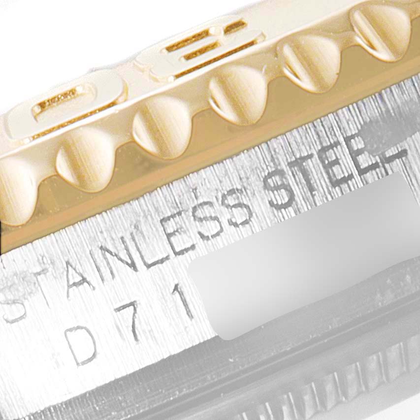 This close-up image shows the bezel and part of the case of a Rolex Yacht-Master 16623 Men's Steel and Gold (two tone) Grey Dial 16623 Men's Steel and Gold (two tone) Grey Dial watch.