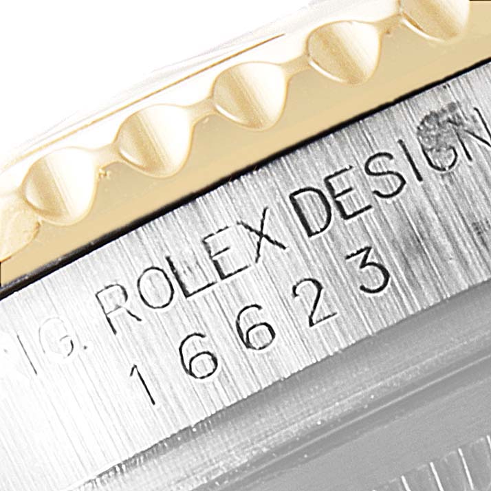 The image shows a close-up of the bezel and side casing of a Rolex Yacht-Master 16623 Men's Steel and Gold (two tone) Grey Dial 16623 Men's Steel and Gold (two tone) Grey Dial watch.