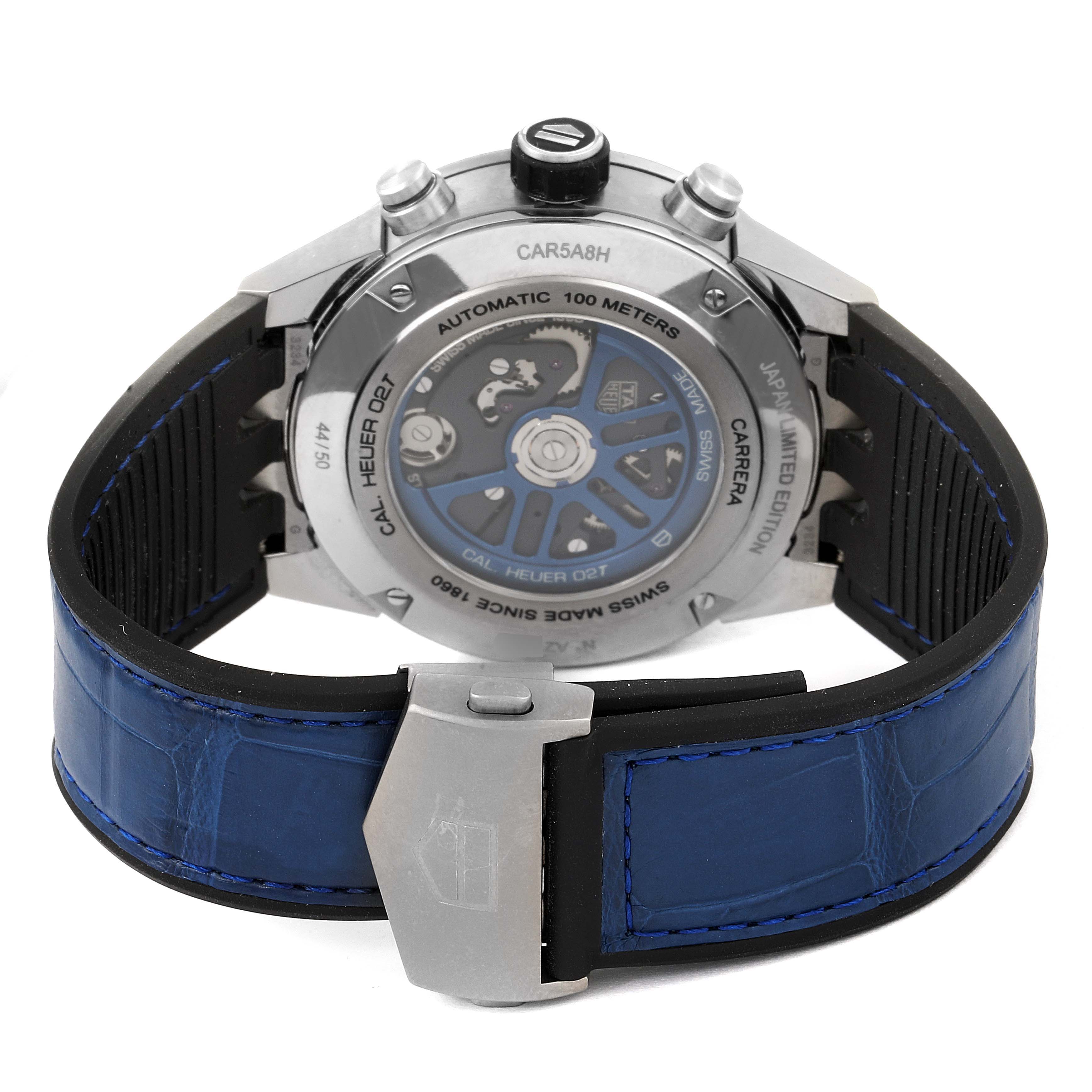 The image displays the back of a Tag Heuer Carrera CAR5A8H.FC6448 Men's Titanium Blue Dial CAR5A8H.FC6448 Men's Titanium Blue Dial watch, showing its automatic movement and blue leather strap with a clasp.