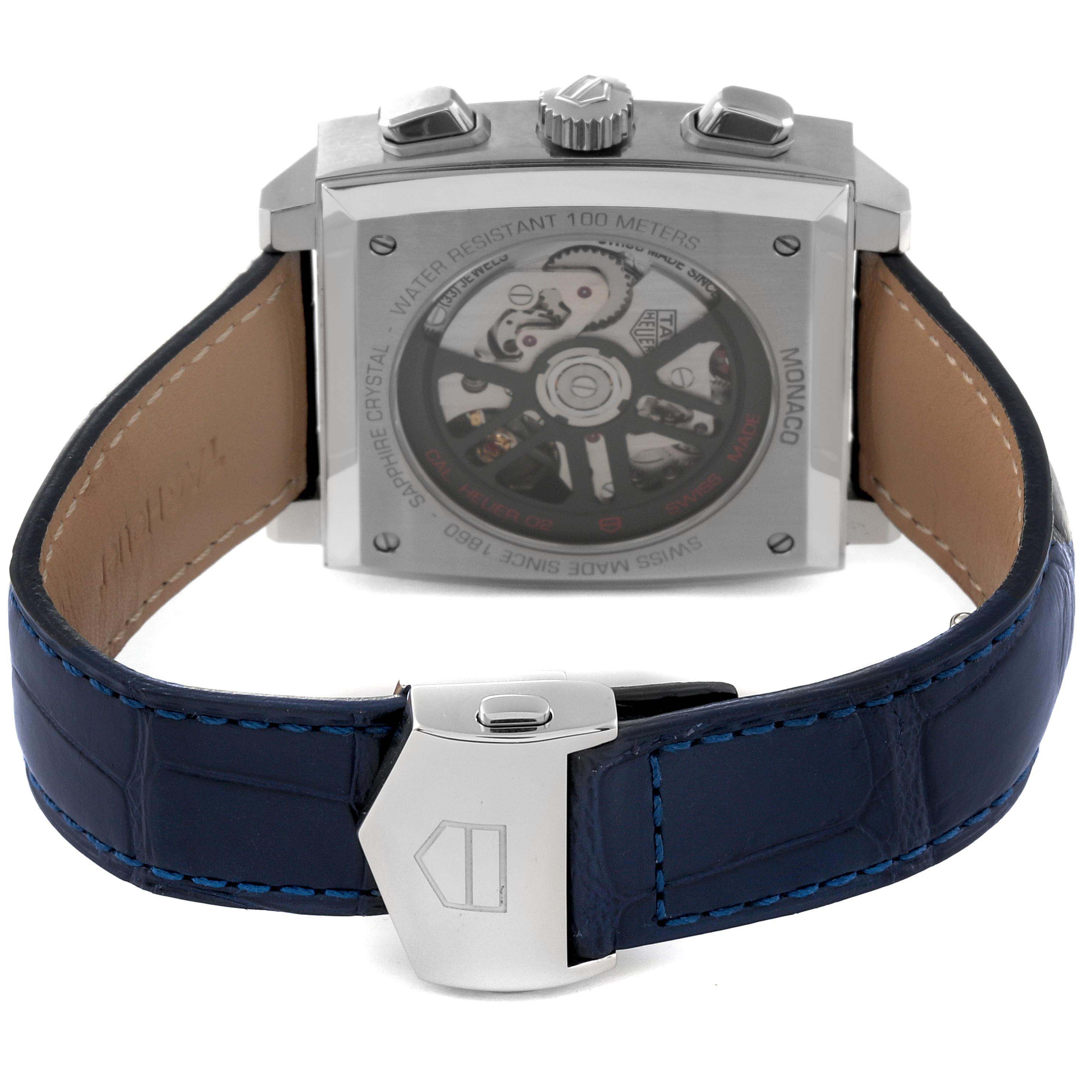 The Tag Heuer Monaco CBL2111.FC6453 Men's Stainless Steel Blue Dial CBL2111.FC6453 Men's Stainless Steel Blue Dial watch is shown from the back, displaying its transparent case back and dark blue leather strap.