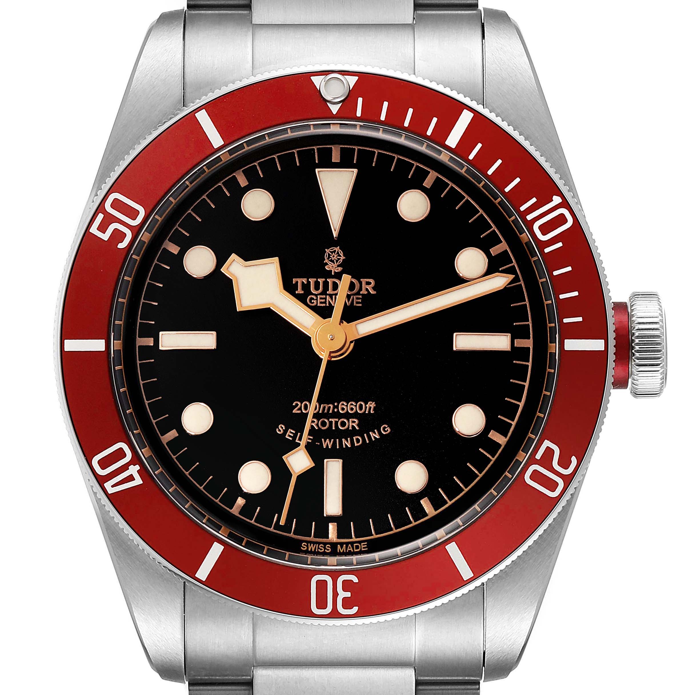 The image shows a front view of the Tudor Heritage Black Bay 79220R Men's Stainless Steel Black Dial 79220R Men's Stainless Steel Black Dial watch, highlighting its red bezel, black dial, and stainless steel bracelet.