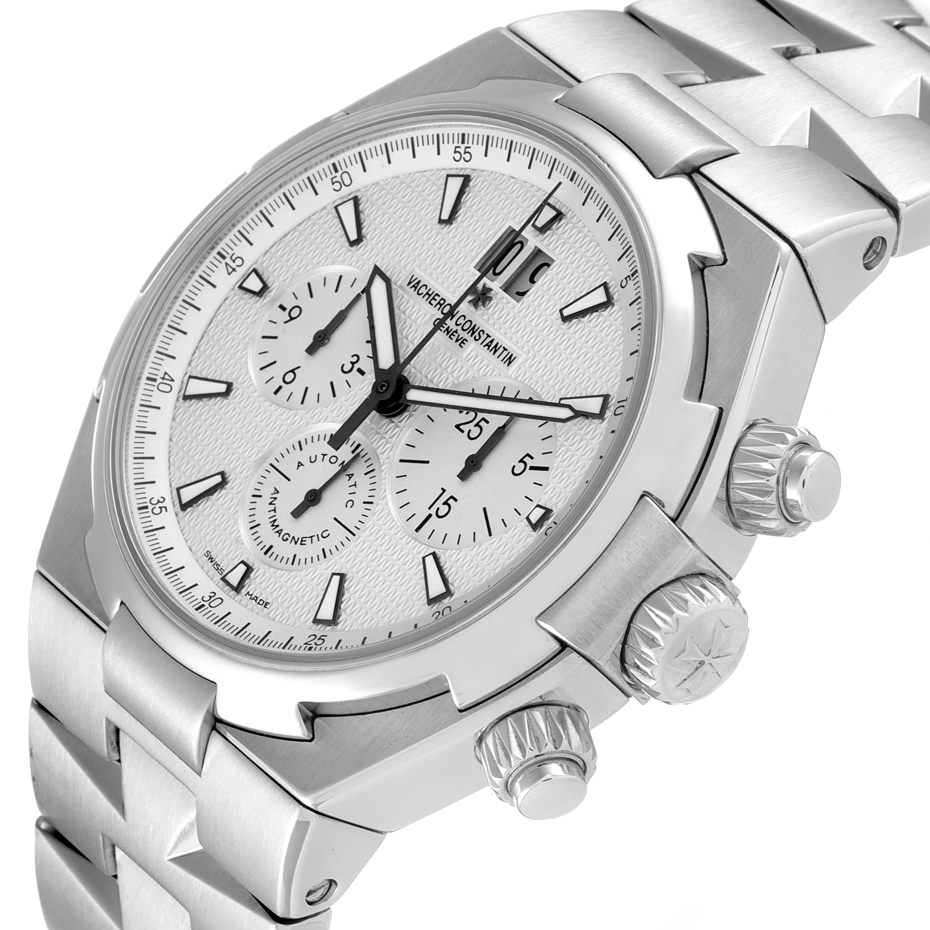 The image shows a Vacheron Constantin Overseas 49150/B01A-9095 Men's Stainless Steel Silver Dial 49150/B01A-9095 Men's Stainless Steel Silver Dial watch from an angled side view highlighting the crown, pushers, and part of the bracelet.