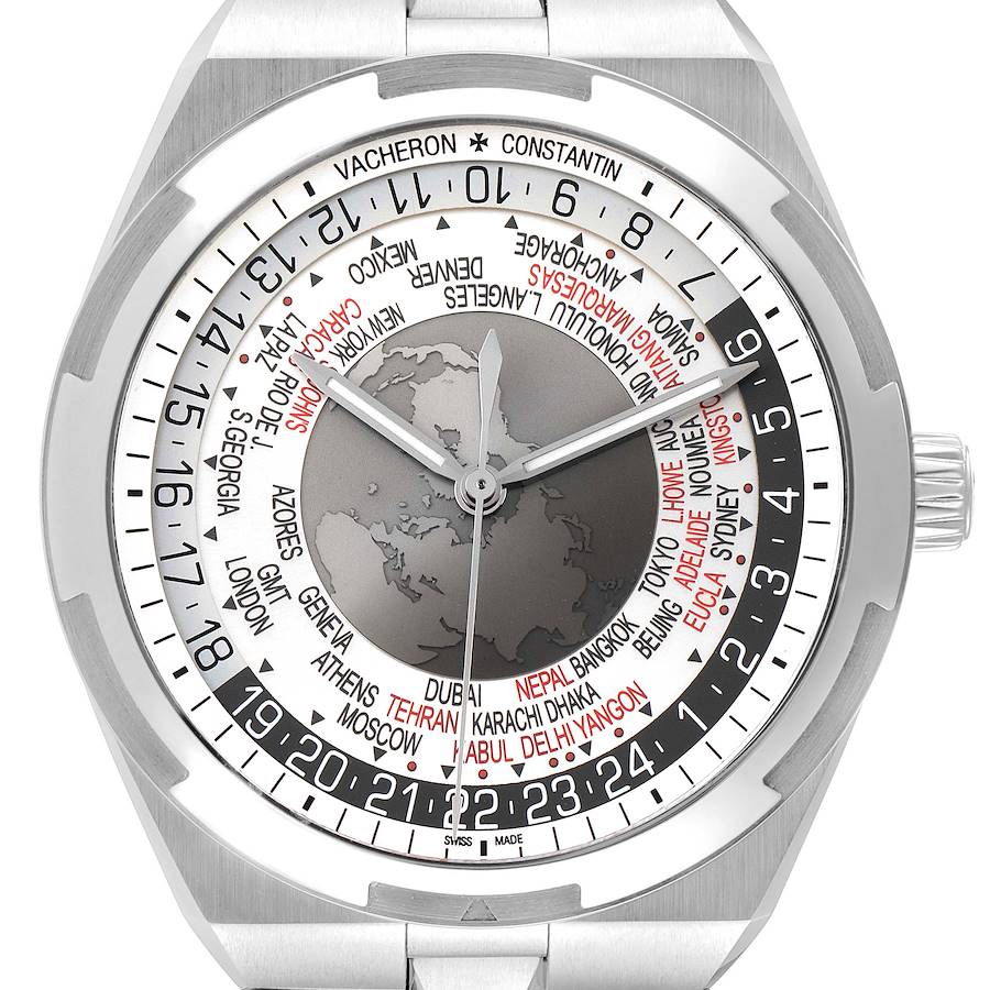 The image shows a front close-up view of a Vacheron Constantin Overseas model watch, highlighting the dial with global time zones and the bezel.