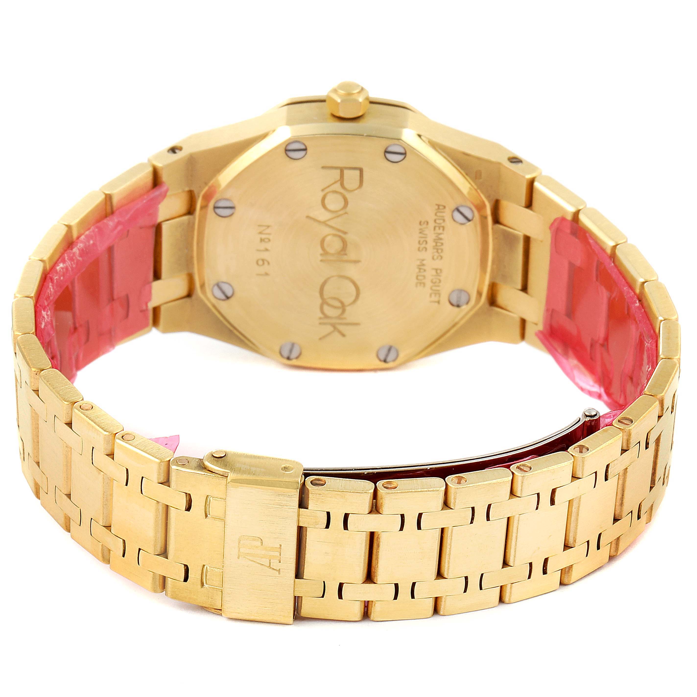 The image shows the back and bracelet of a gold Royal Oak model by Audemars Piguet, displaying the case back, clasp, and bracelet links.