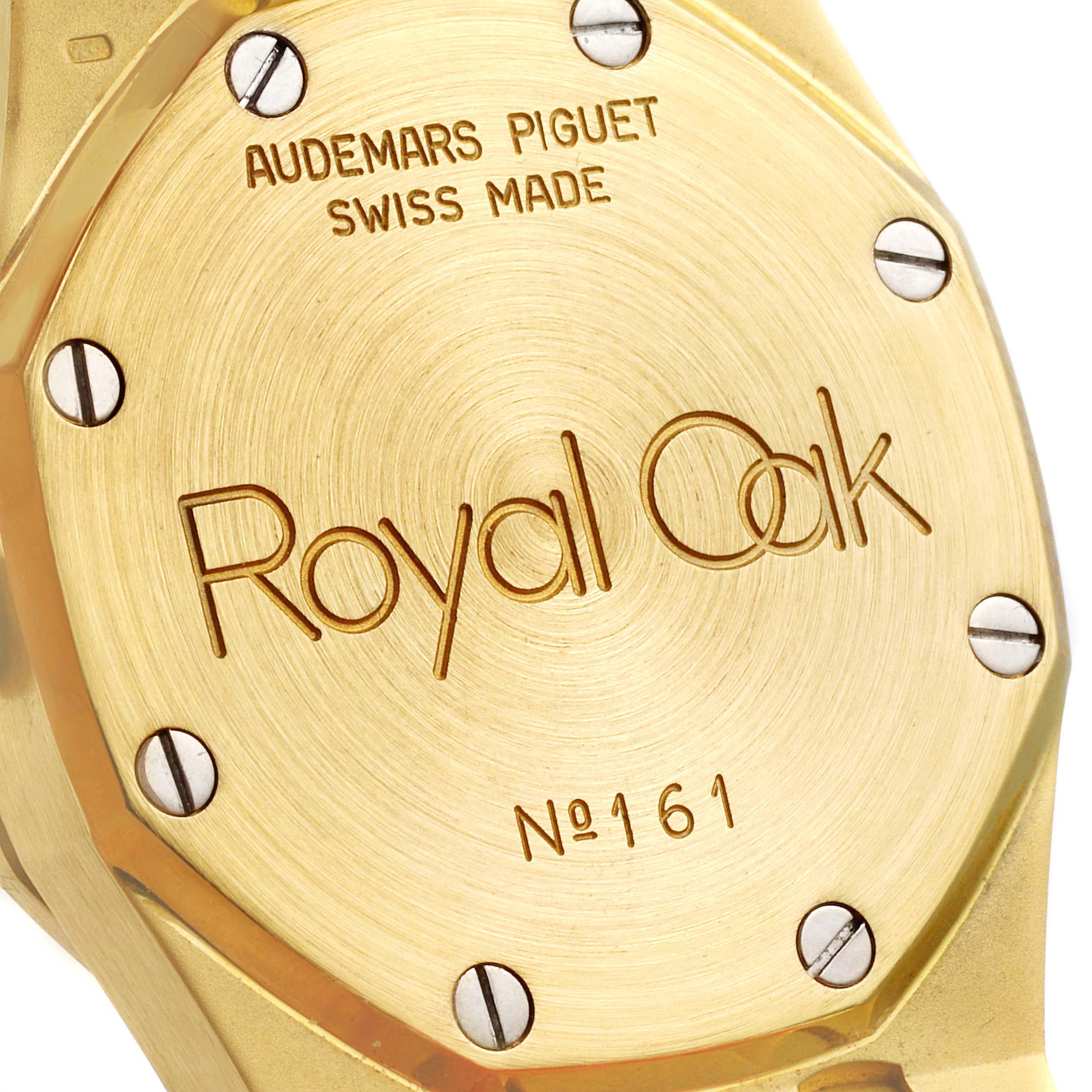 The image shows the case back of an Audemars Piguet Royal Oak 14587BA.Z.0902BA.01 Women
s Yellow Gold Champagne Dial 14587BA.Z.0902BA.01 Women
s Yellow Gold Champagne Dial watch, including the brand engraving and serial number 161.
