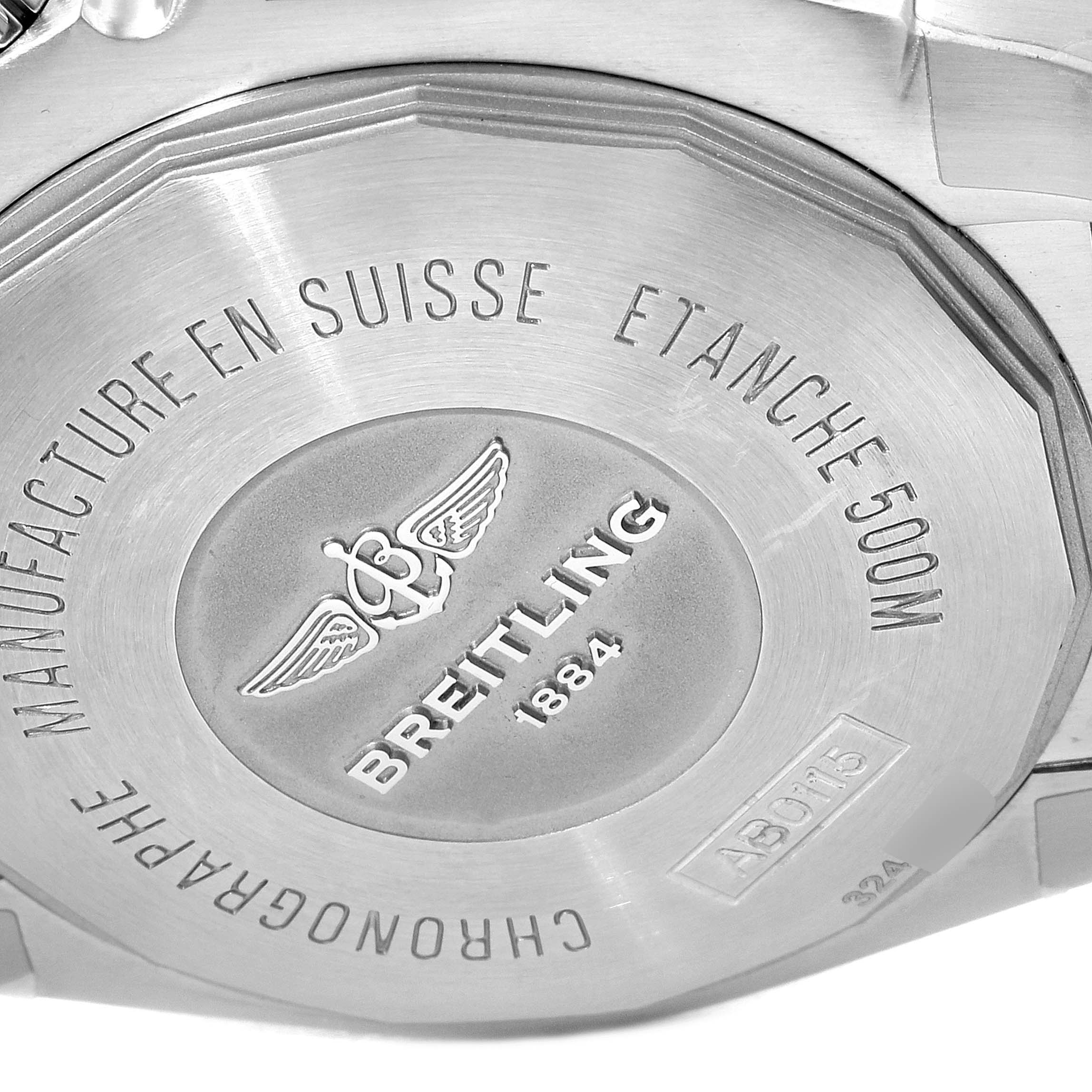 The image shows the back case of a Breitling Chronomat AB0115 Men
s Stainless Steel Blue Dial AB0115 Men
s Stainless Steel Blue Dial watch, featuring engravings and the brand logo.