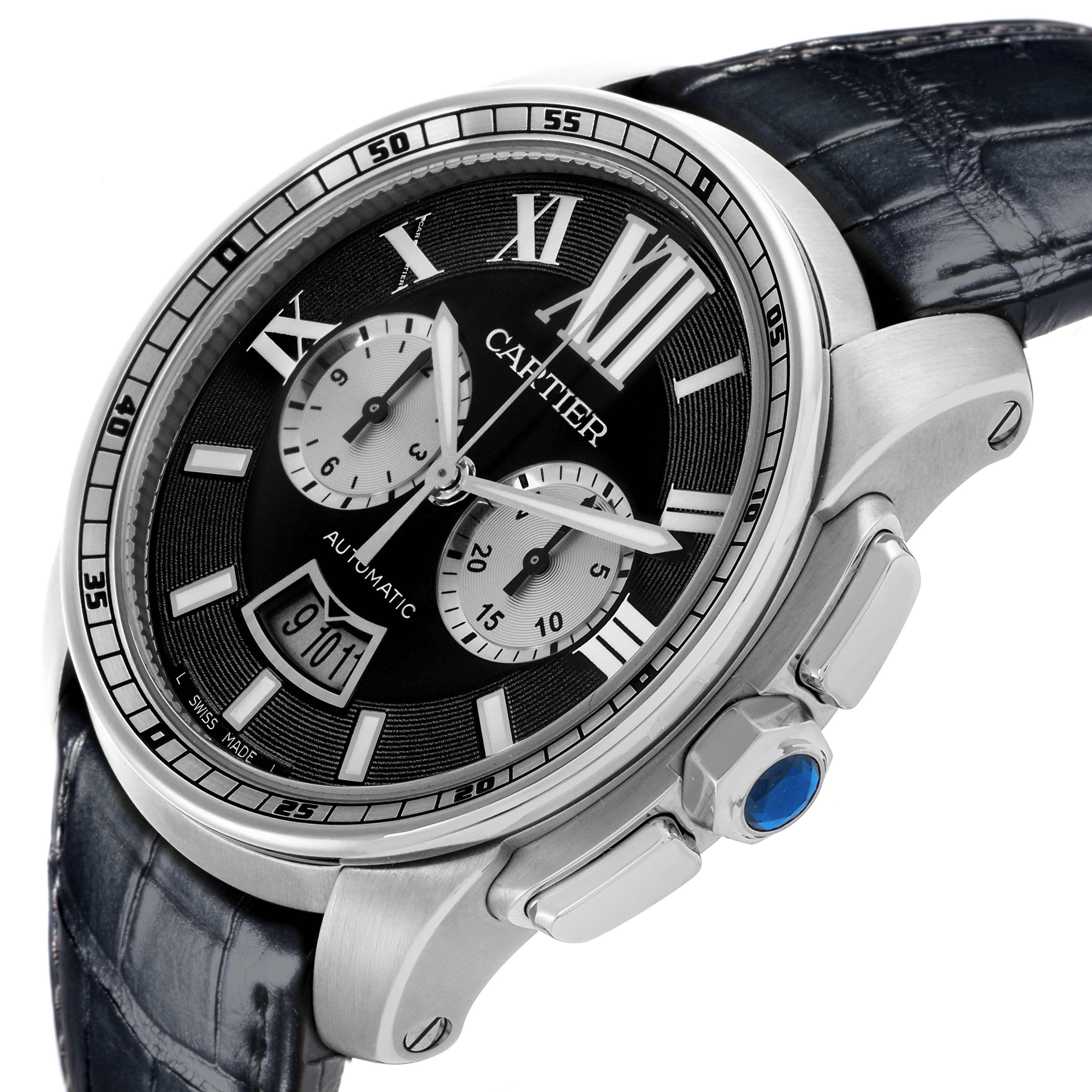 The Calibre de Cartier watch is shown at a slight angle, highlighting the dial, bezel, lugs, and partially the crown with a blue cabochon.