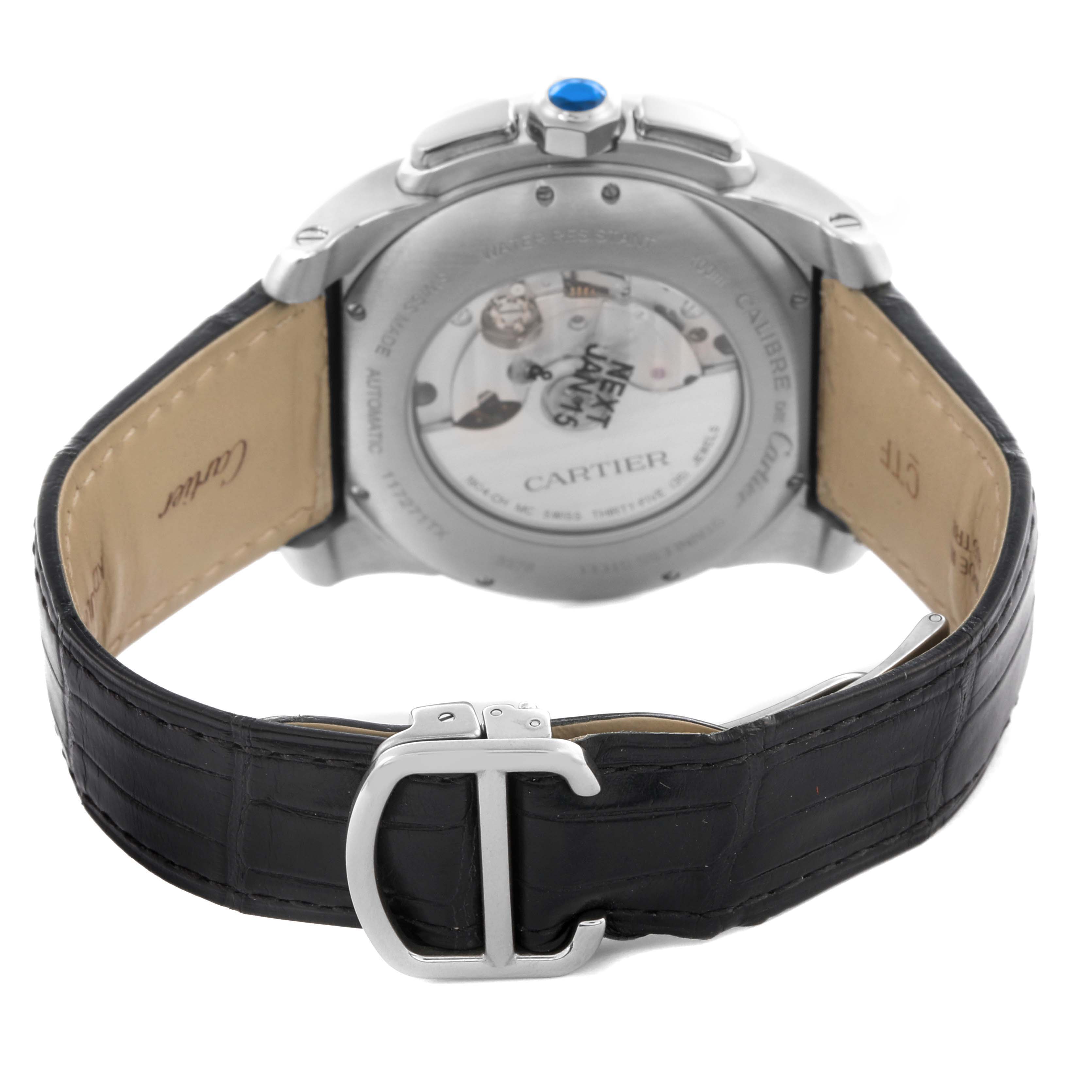 The image shows the back of the Calibre de Cartier watch, highlighting the case back, leather strap, and buckle.