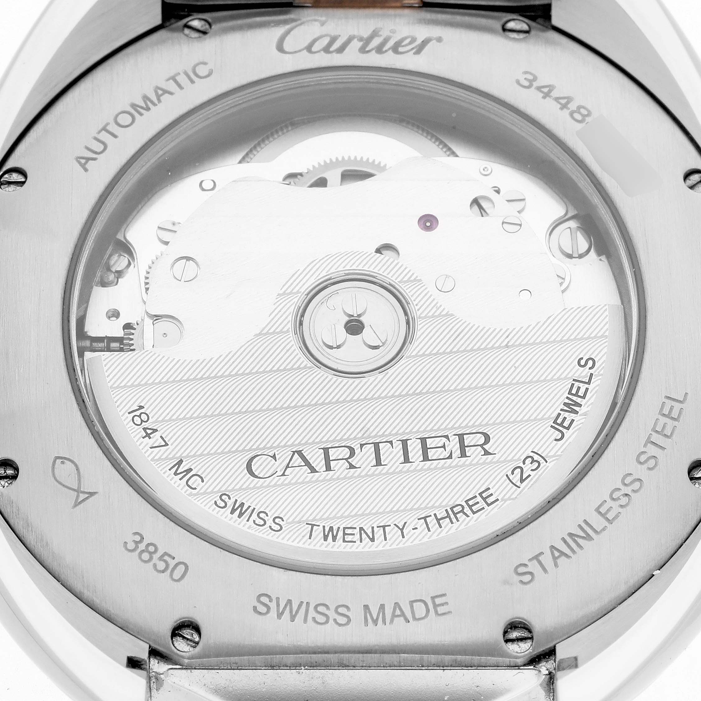 The image shows the back of the Cartier Clé watch, highlighting the automatic movement and internal mechanism.