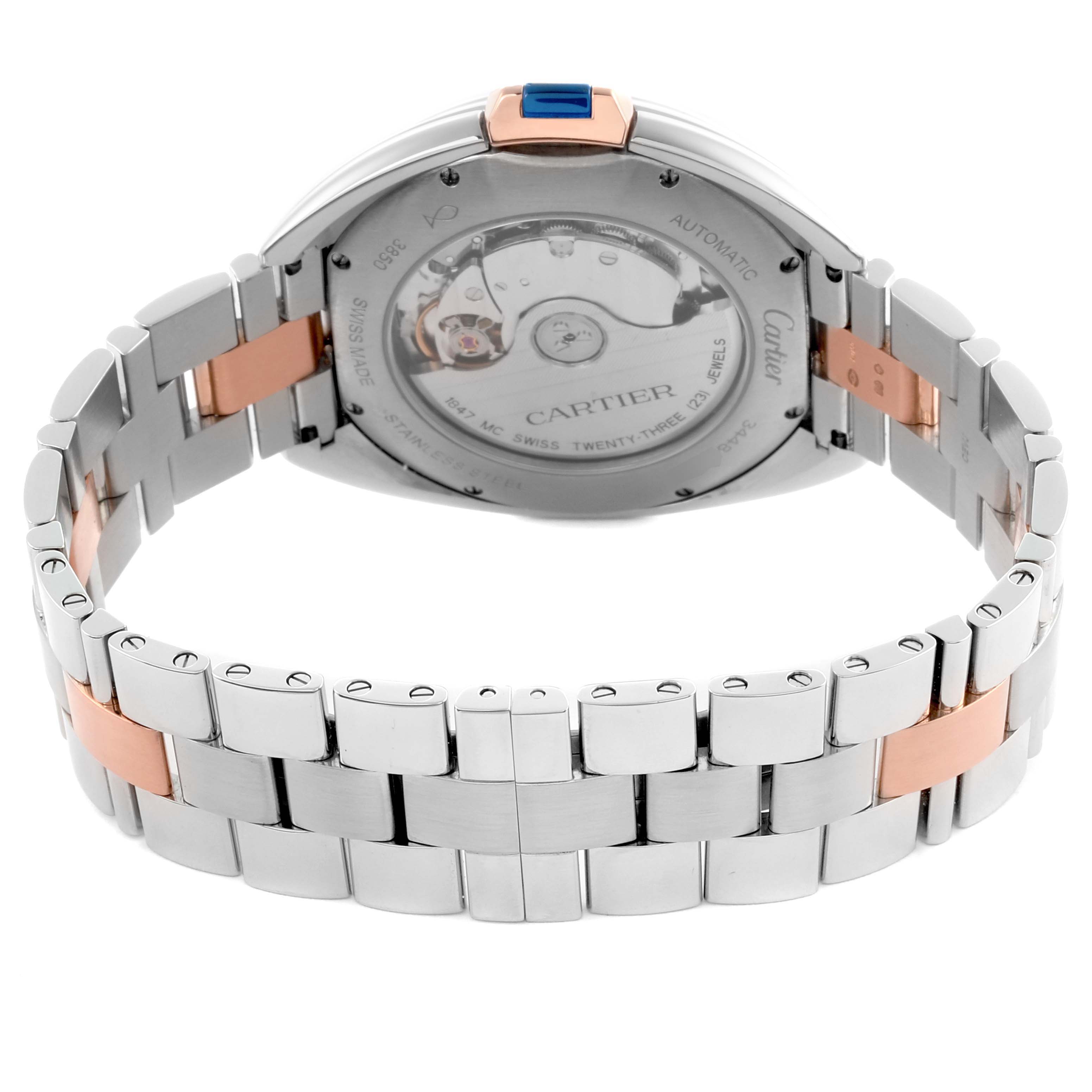 The image shows the back of a Cartier Clé watch, highlighting the automatic movement and a metal bracelet with rose gold accents.