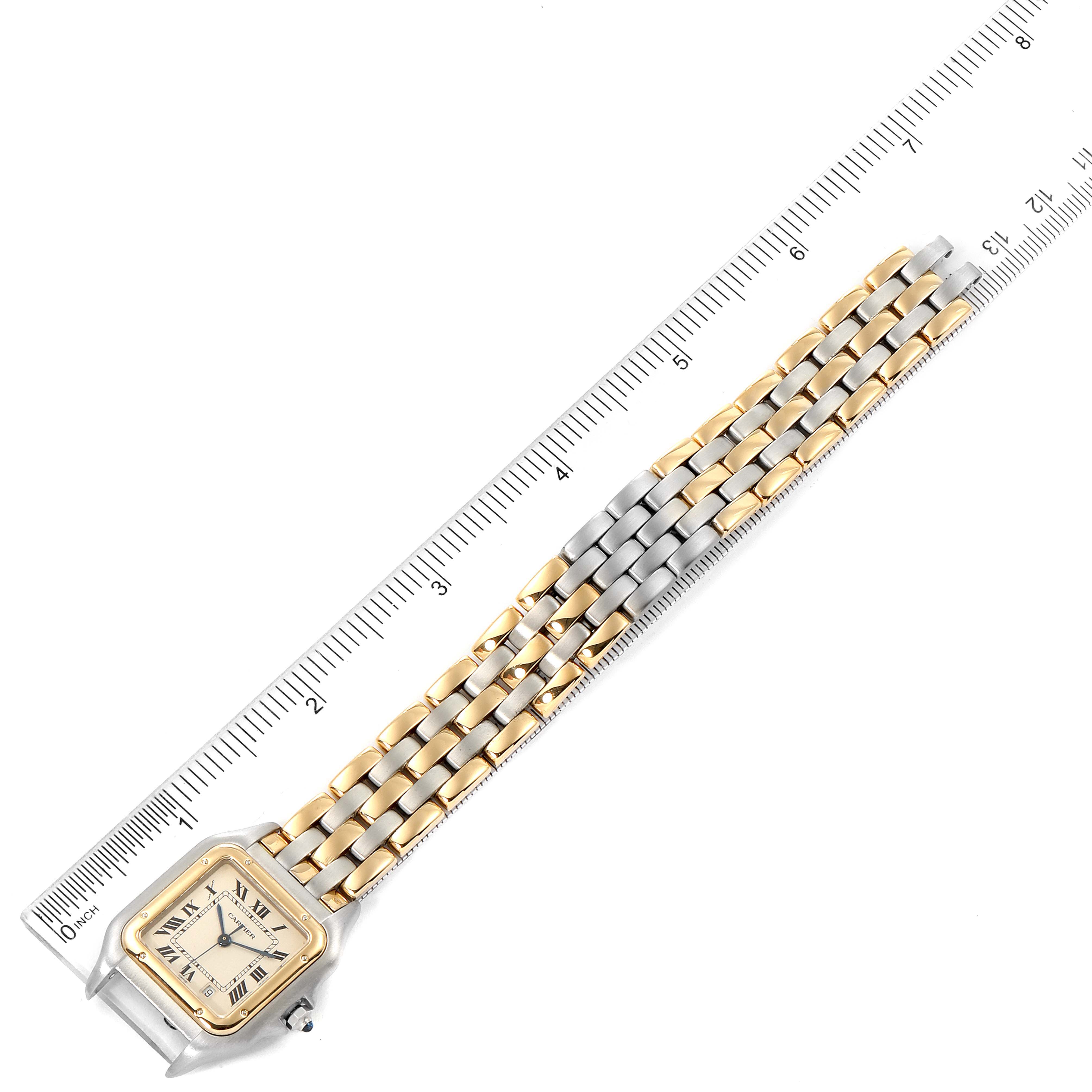 The Cartier Panthere W25028B6 Women
s Steel and Gold (two tone) Silver Dial W25028B6 Women
s Steel and Gold (two tone) Silver Dial watch is shown from an angled top view, highlighting the two-tone bracelet and square face beside a ruler for scale.