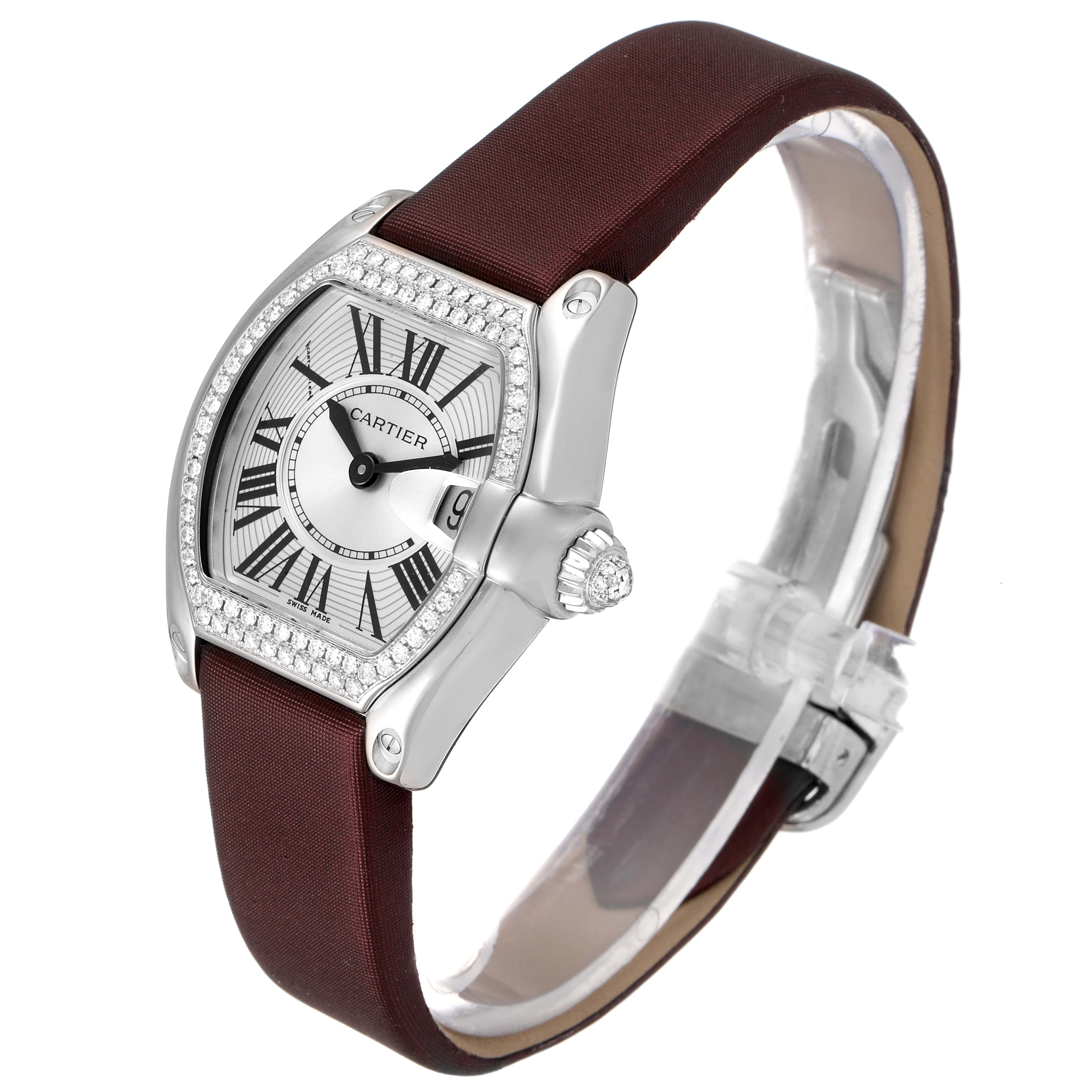 This image shows a Cartier Roadster WE500260 Women's White Gold Silver Dial WE500260 Women's White Gold Silver Dial watch from an angled side view, highlighting the face, bezel, and strap.