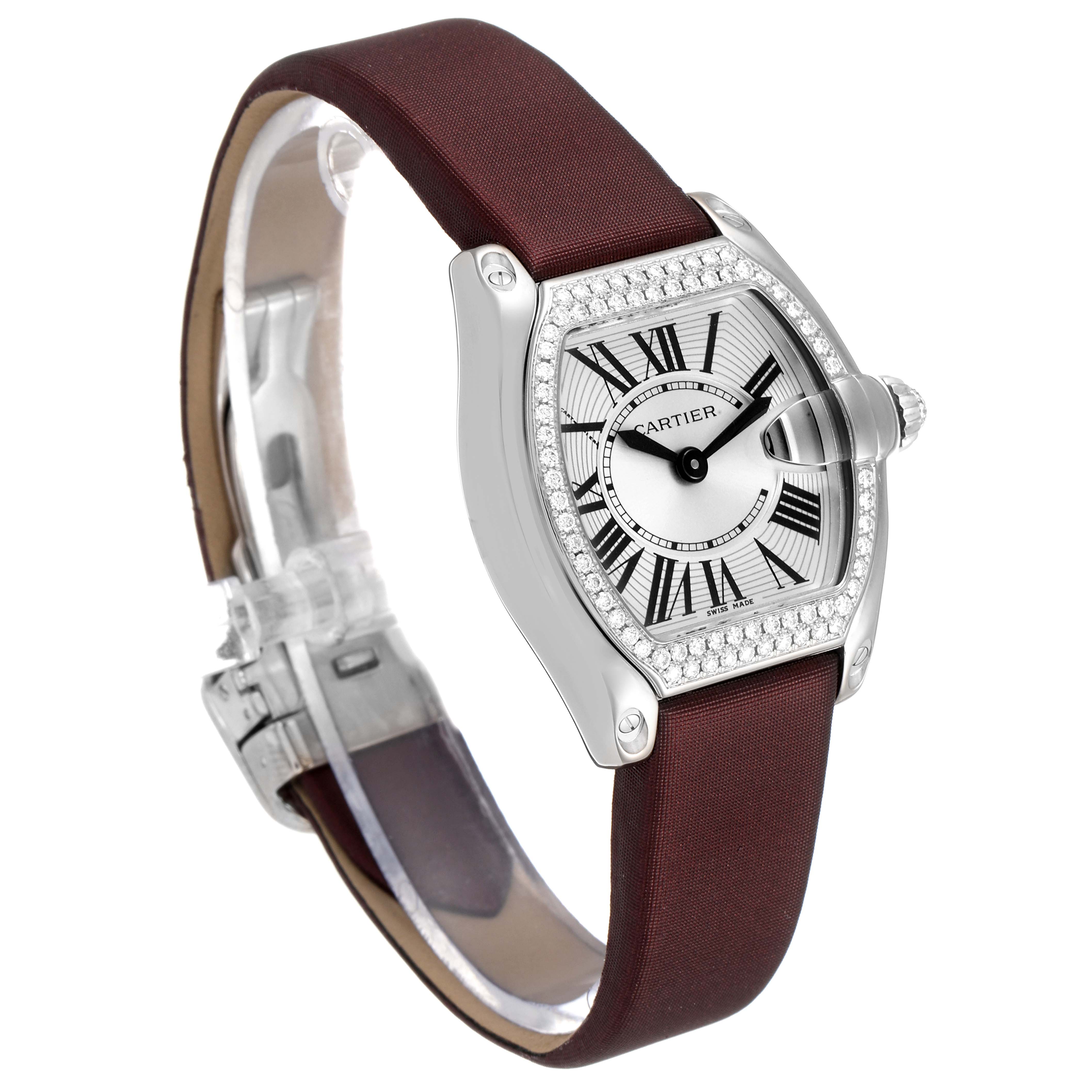 This image shows the Cartier Roadster WE500260 Women's White Gold Silver Dial WE500260 Women's White Gold Silver Dial watch at a slight angle from the left side, highlighting the watch face and strap.