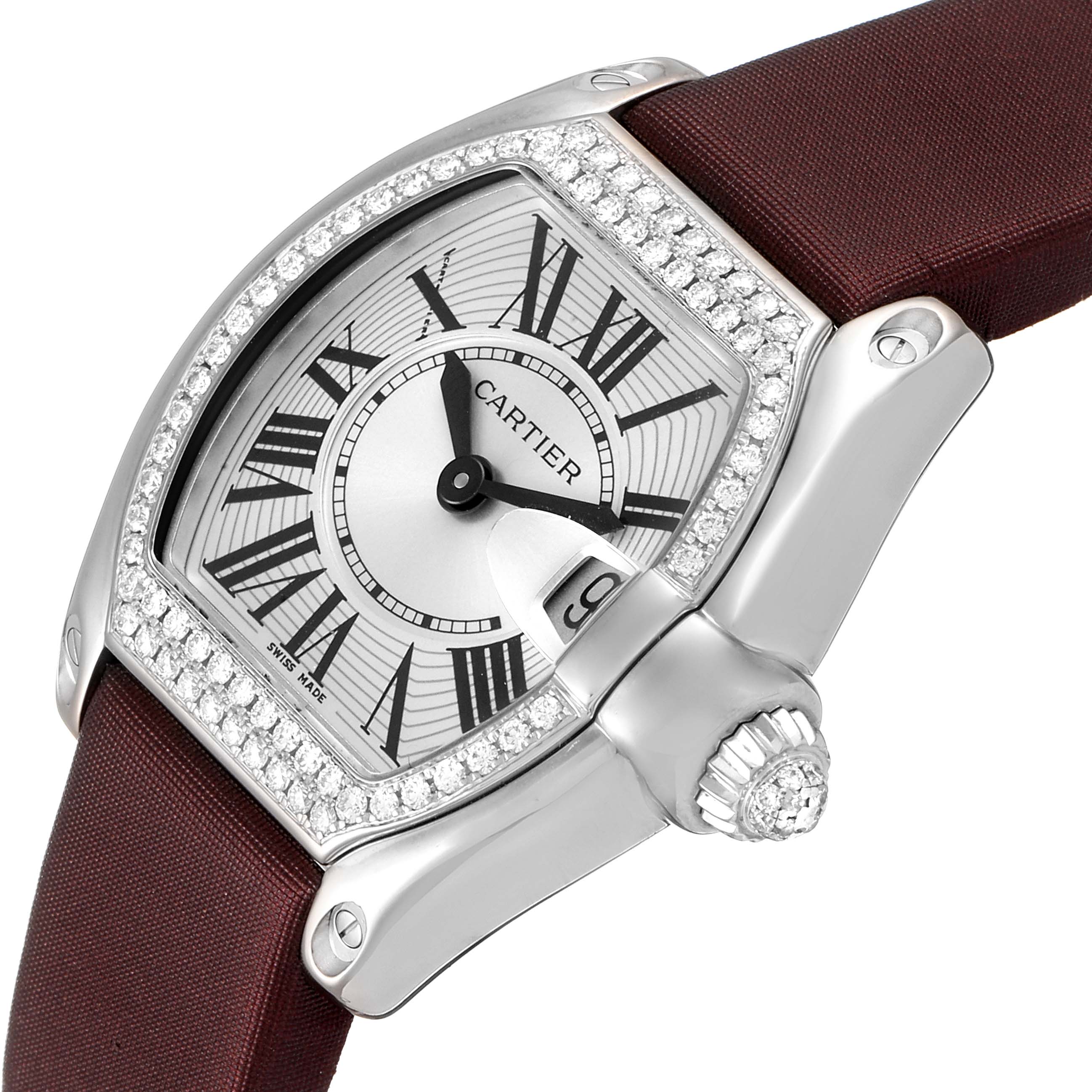 The image shows a close-up, angled view of a Cartier Roadster WE500260 Women's White Gold Silver Dial WE500260 Women's White Gold Silver Dial model watch highlighting its dial, bezel, and crown.