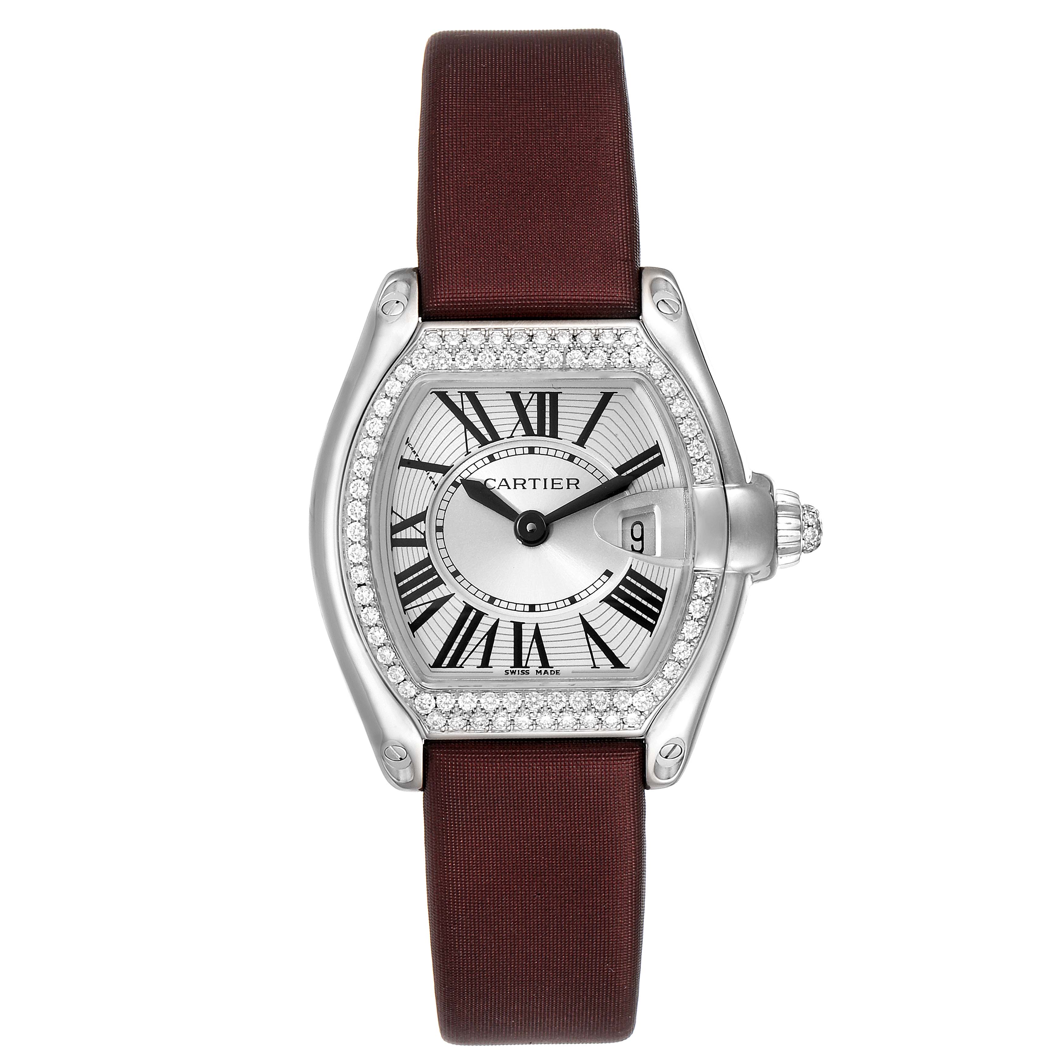 This image shows the front view of a Cartier Roadster WE500260 Women's White Gold Silver Dial WE500260 Women's White Gold Silver Dial watch with a maroon strap and diamond-encrusted bezel.