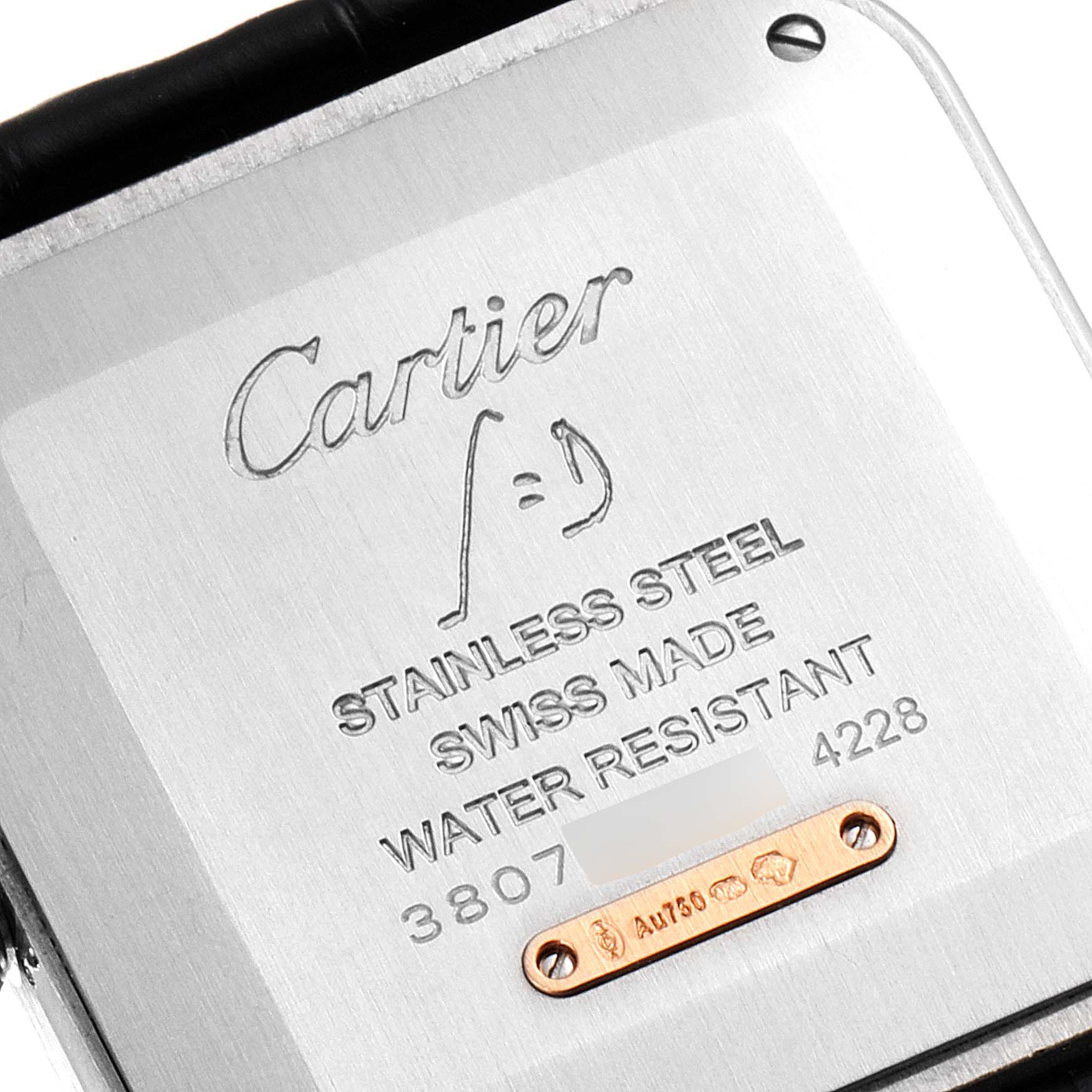 This image shows the back case of a Cartier Santos Dumont W2SA0011 Men's Steel and Gold (two tone) Silver Dial W2SA0011 Men's Steel and Gold (two tone) Silver Dial watch with brand and material details.