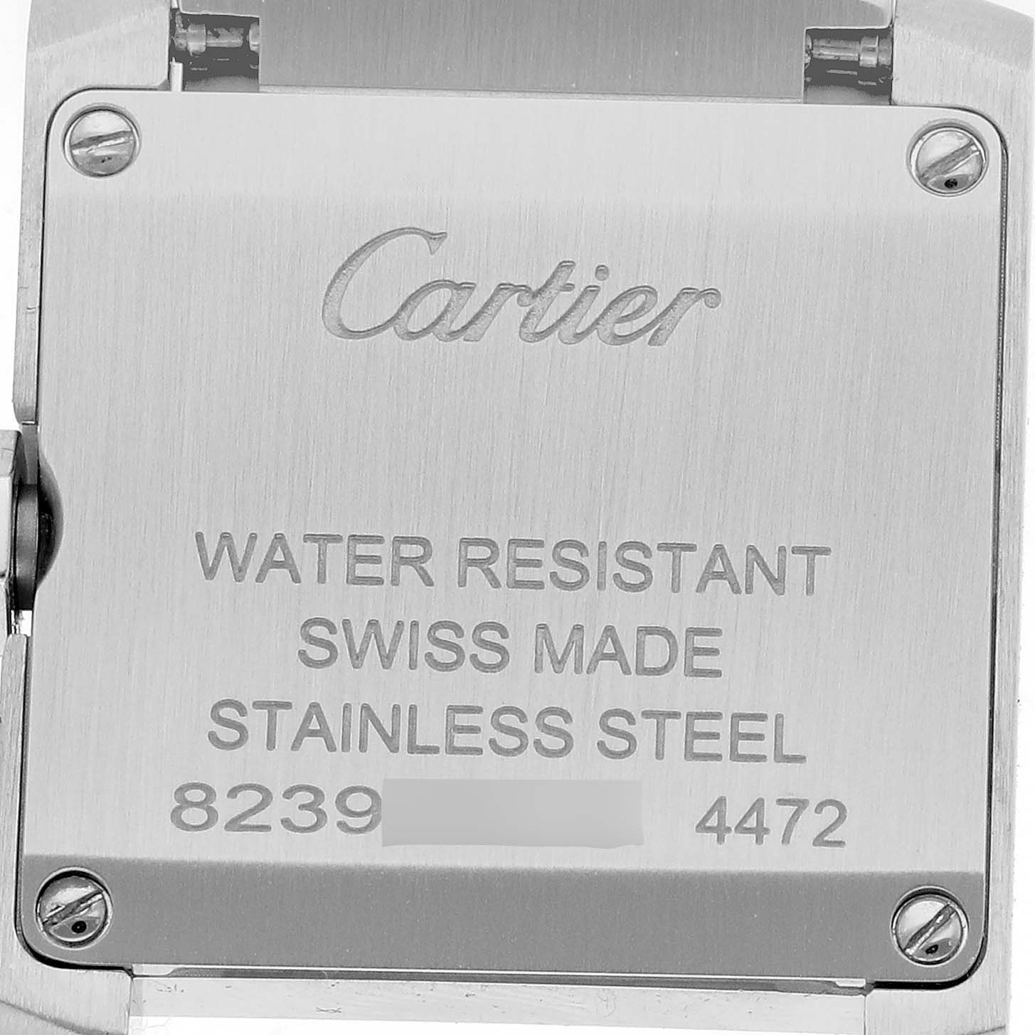 The image shows the back case of a Cartier Tank Française watch with engraved details and screws.