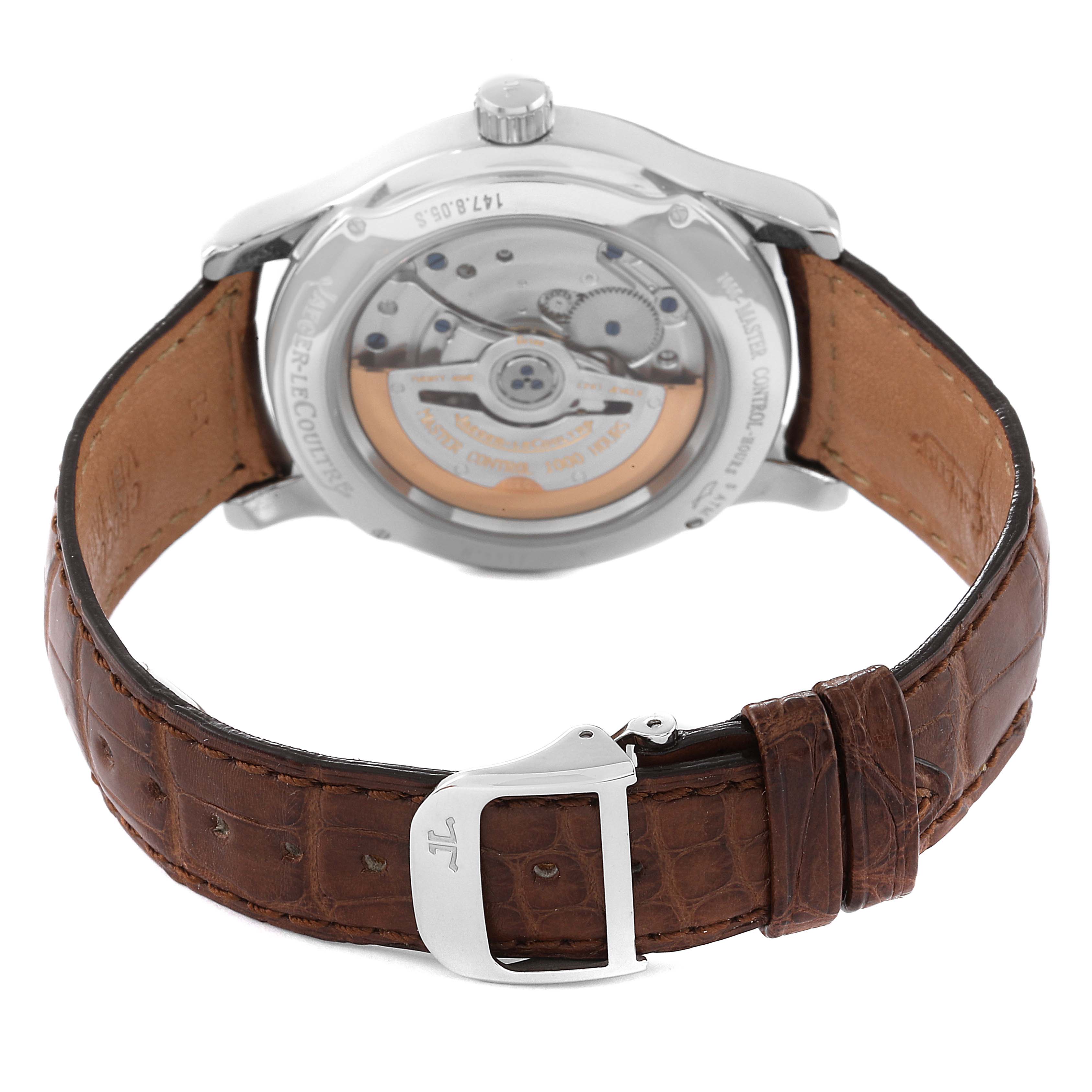 This image shows the back view of a Jaeger-LeCoultre Master model watch, displaying the movement and brown leather strap with a buckle.