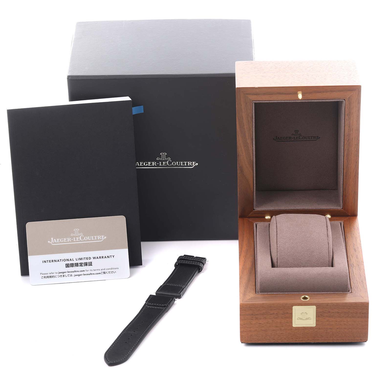 The image shows the packaging, warranty booklet, and a strap for the Jaeger LeCoultre Reverso Q389848J Men's Stainless Steel Transparent Dial Q389848J Men's Stainless Steel Transparent Dial model.