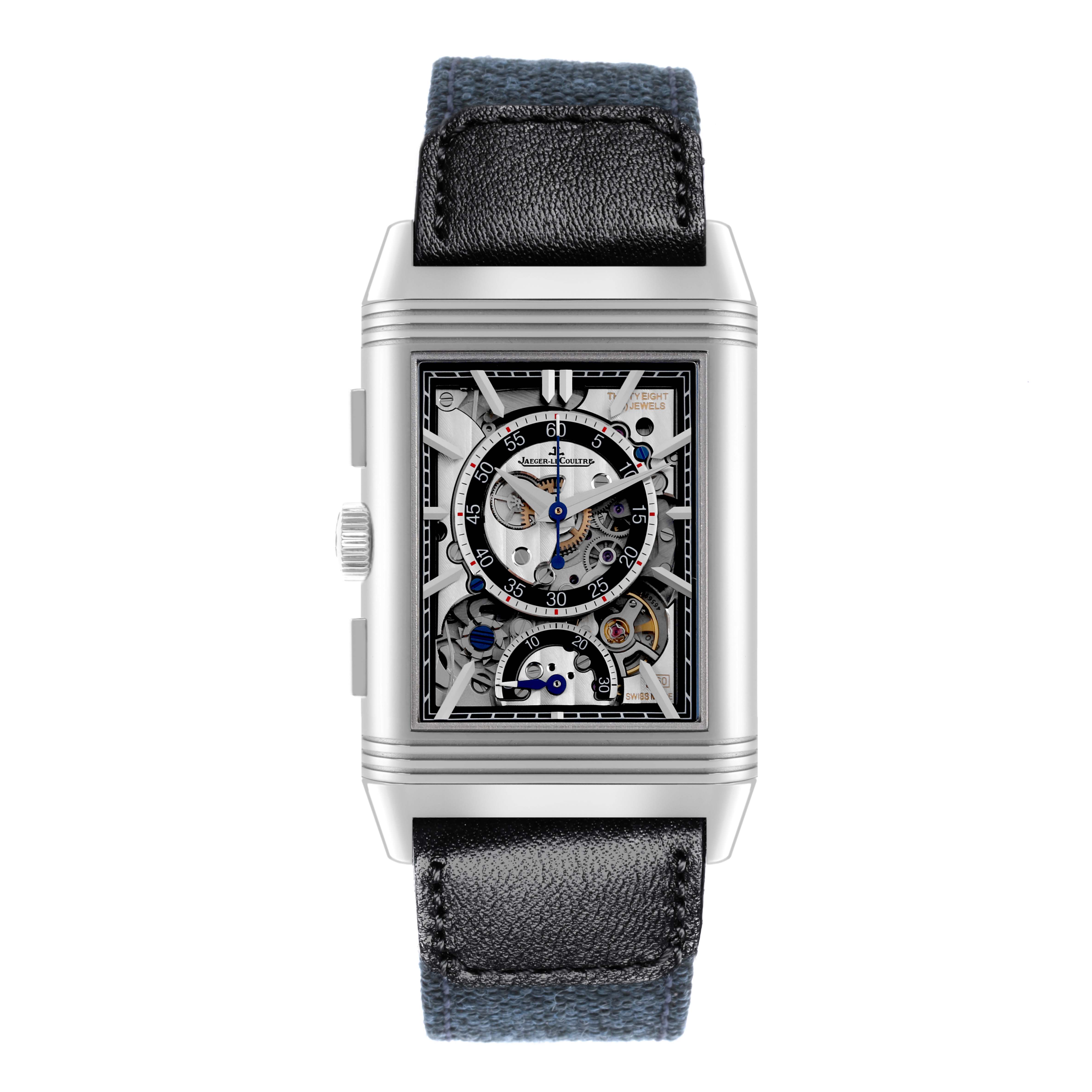 The Jaeger-LeCoultre Reverso watch is shown from the front, displaying its detailed open-worked dial and leather strap.