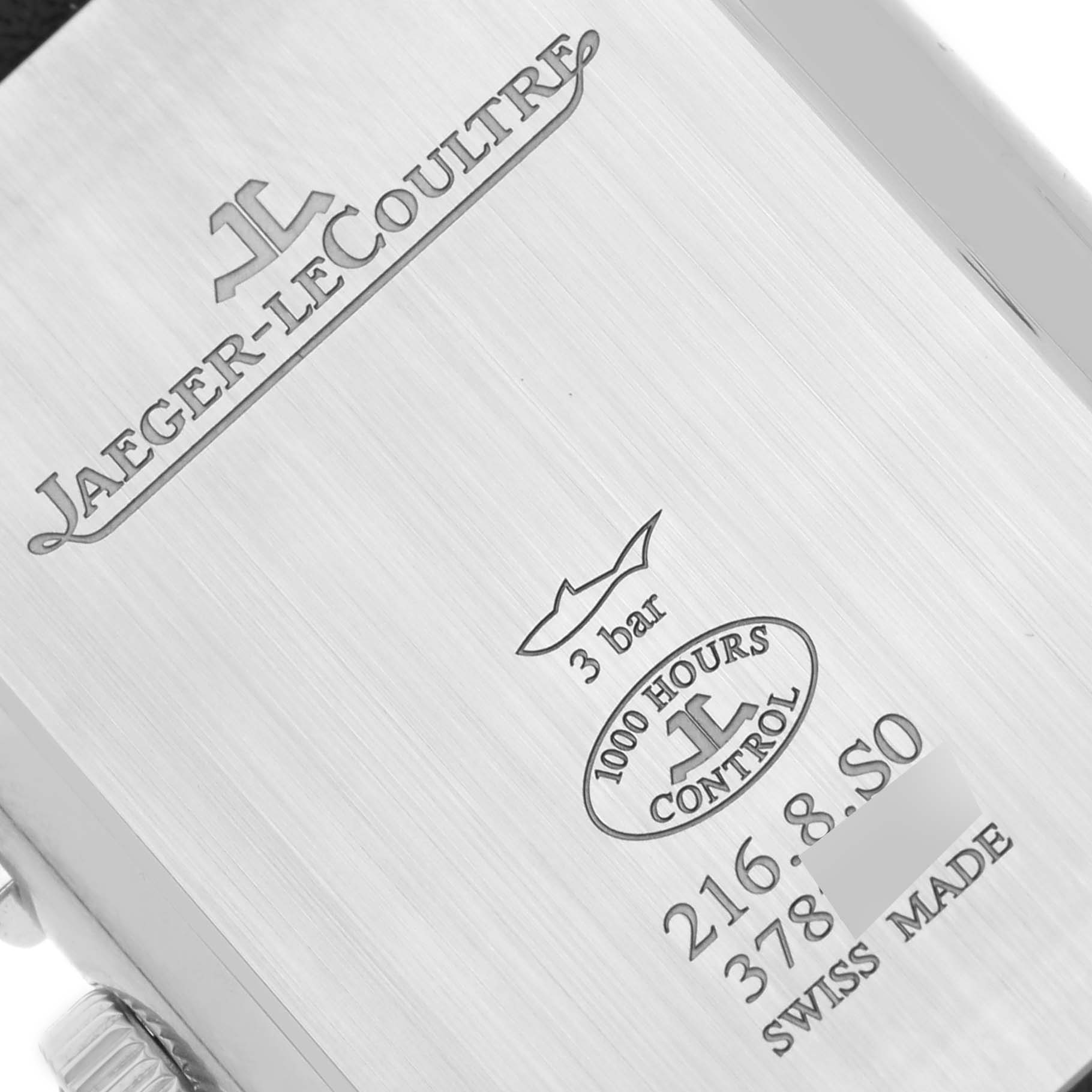 The image shows the engraved back of a Jaeger-LeCoultre Reverso model watch, highlighting its branding and specifications.