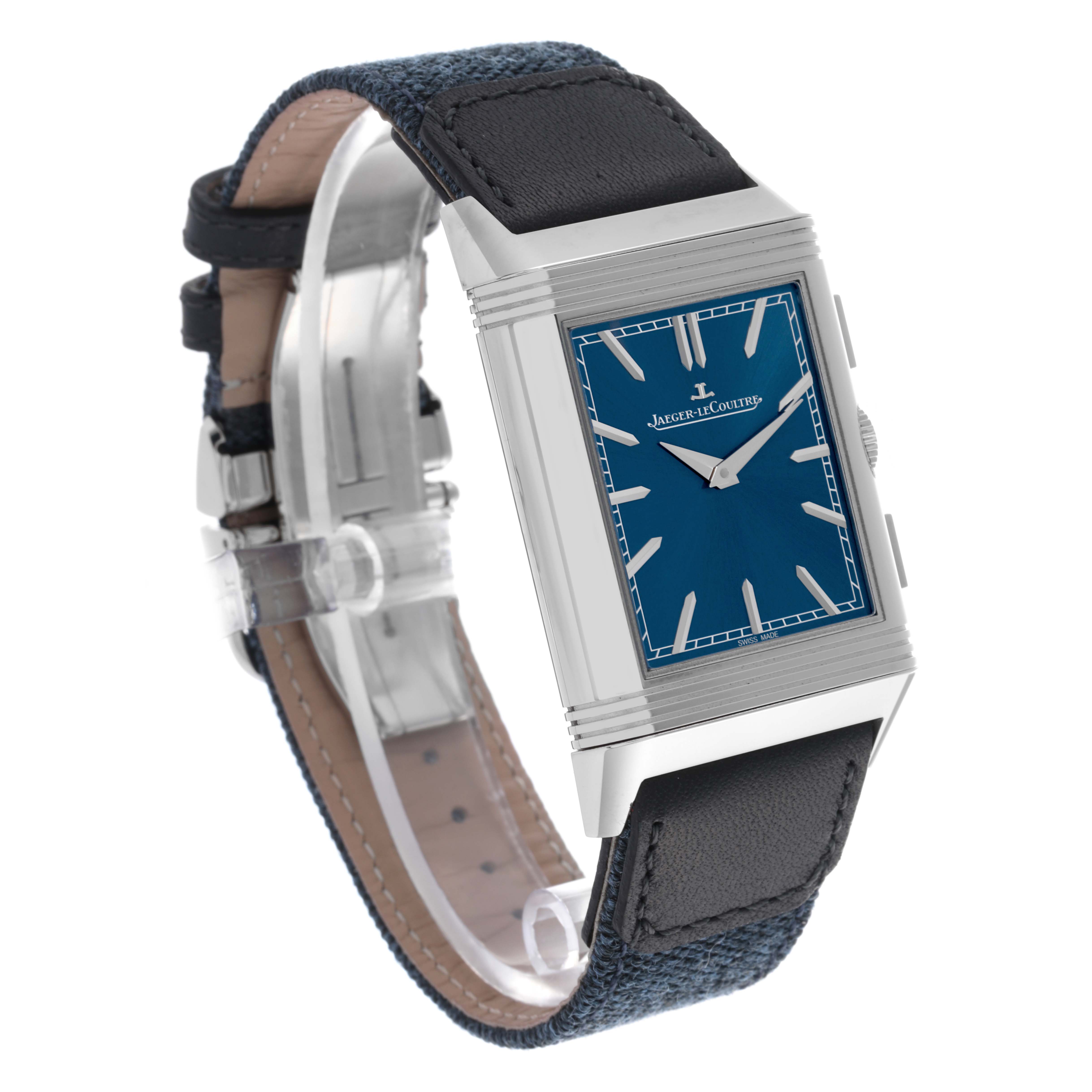 The Jaeger-LeCoultre Reverso watch is shown at an angle, highlighting its rectangular face, blue dial, and leather strap.