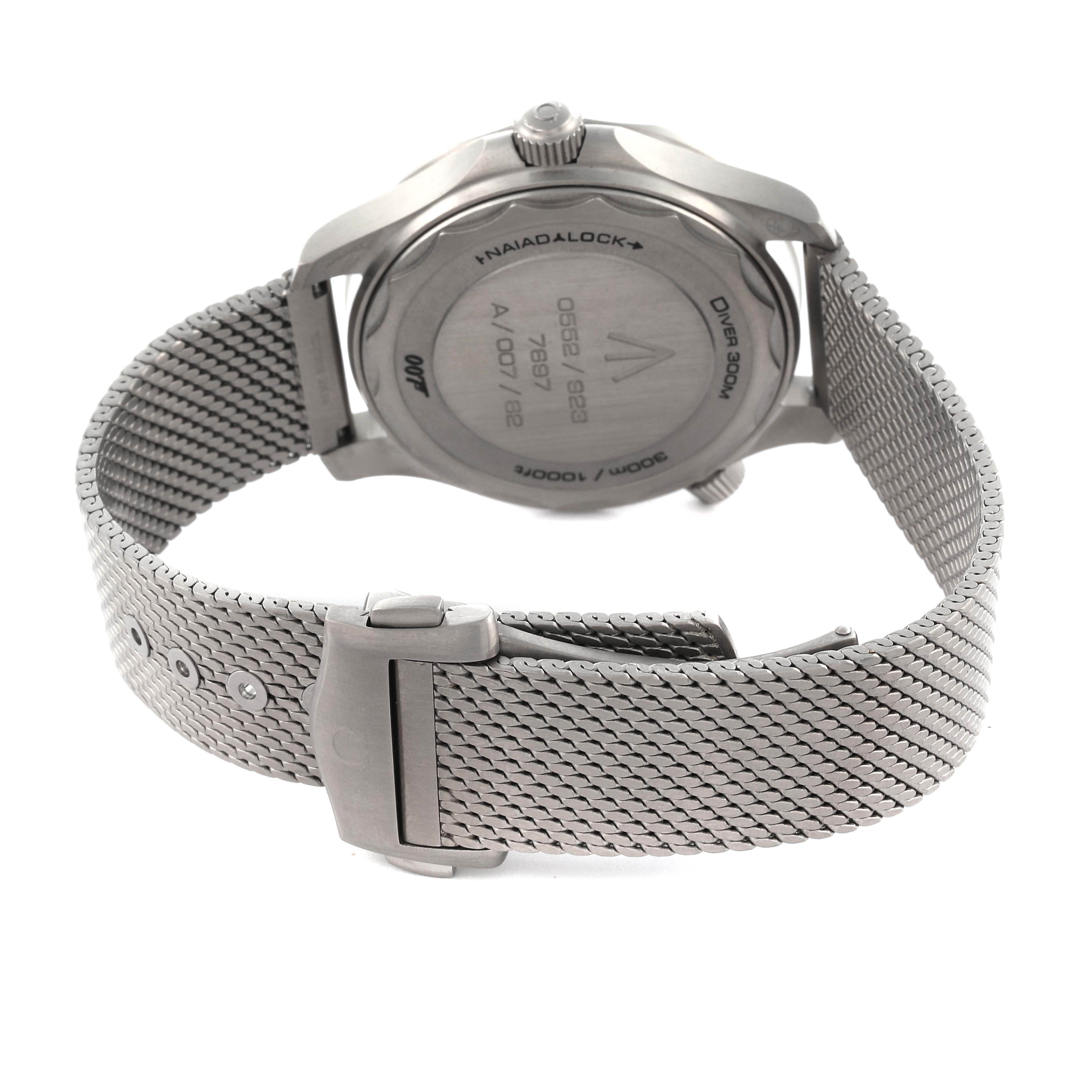 The image shows the back of an Omega Seamaster 210.90.42.20.01.001 Men's Titanium Brown Dial 210.90.42.20.01.001 Men's Titanium Brown Dial watch, highlighting its case back, crown, and clasped metal mesh bracelet.