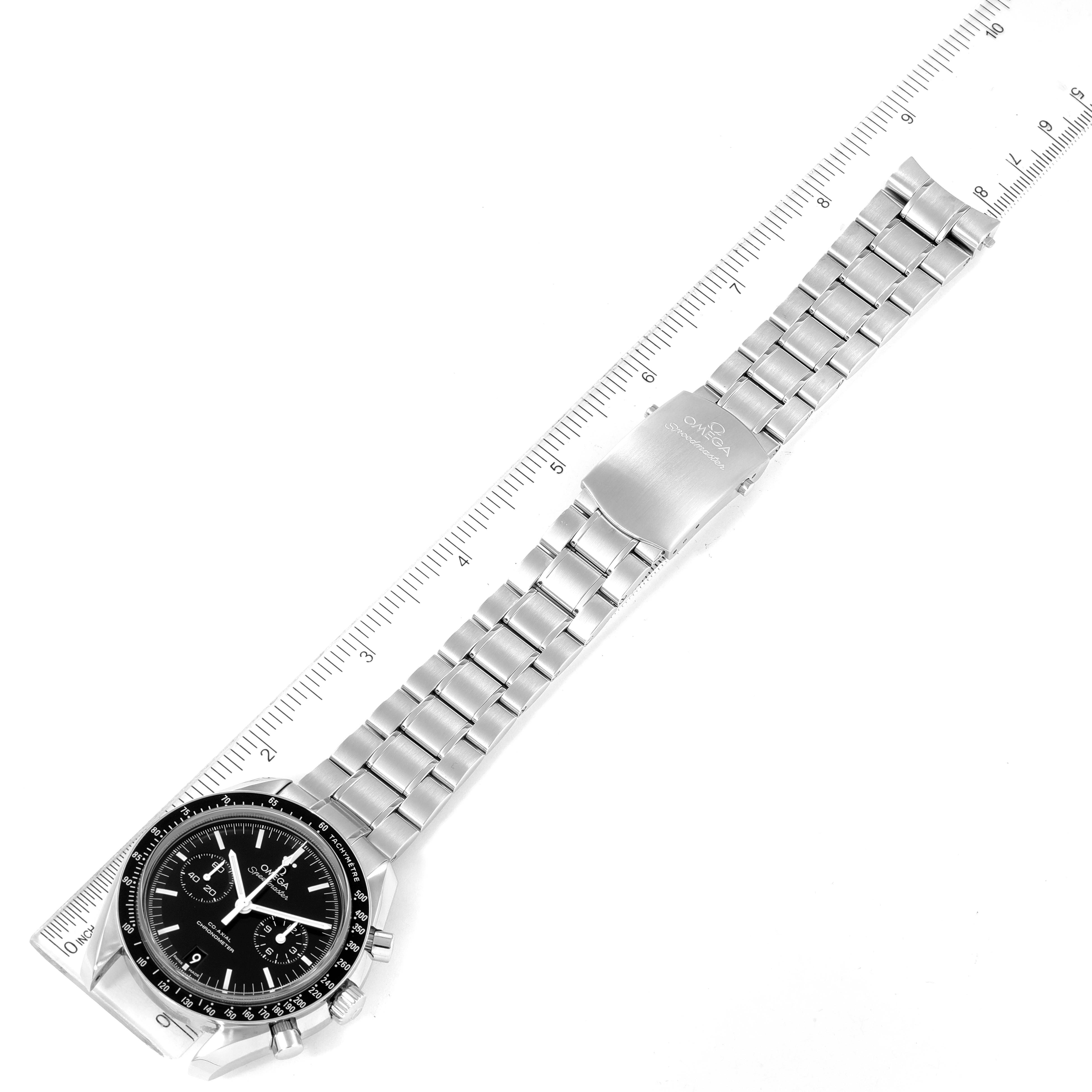 The image shows an Omega Speedmaster 311.30.44.51.01.002 Men's Stainless Steel Black Dial 311.30.44.51.01.002 Men's Stainless Steel Black Dial watch laid flat with its stainless steel bracelet and clasp visible, alongside a ruler for scale.