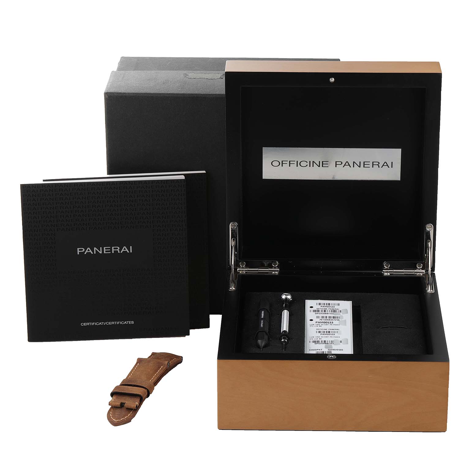 The image shows an open Panerai Luminor PAM00533 Men
s Stainless Steel Black Dial PAM00533 Men
s Stainless Steel Black Dial watch box with accessories, a manual, and an extra brown leather strap.