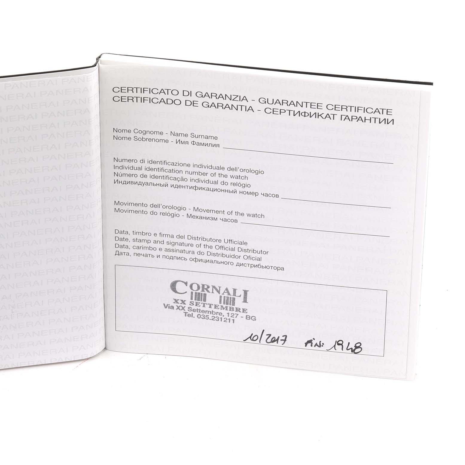 This is a photo of the guarantee certificate for the Luminor model by Panerai, shown from a top-down angle.