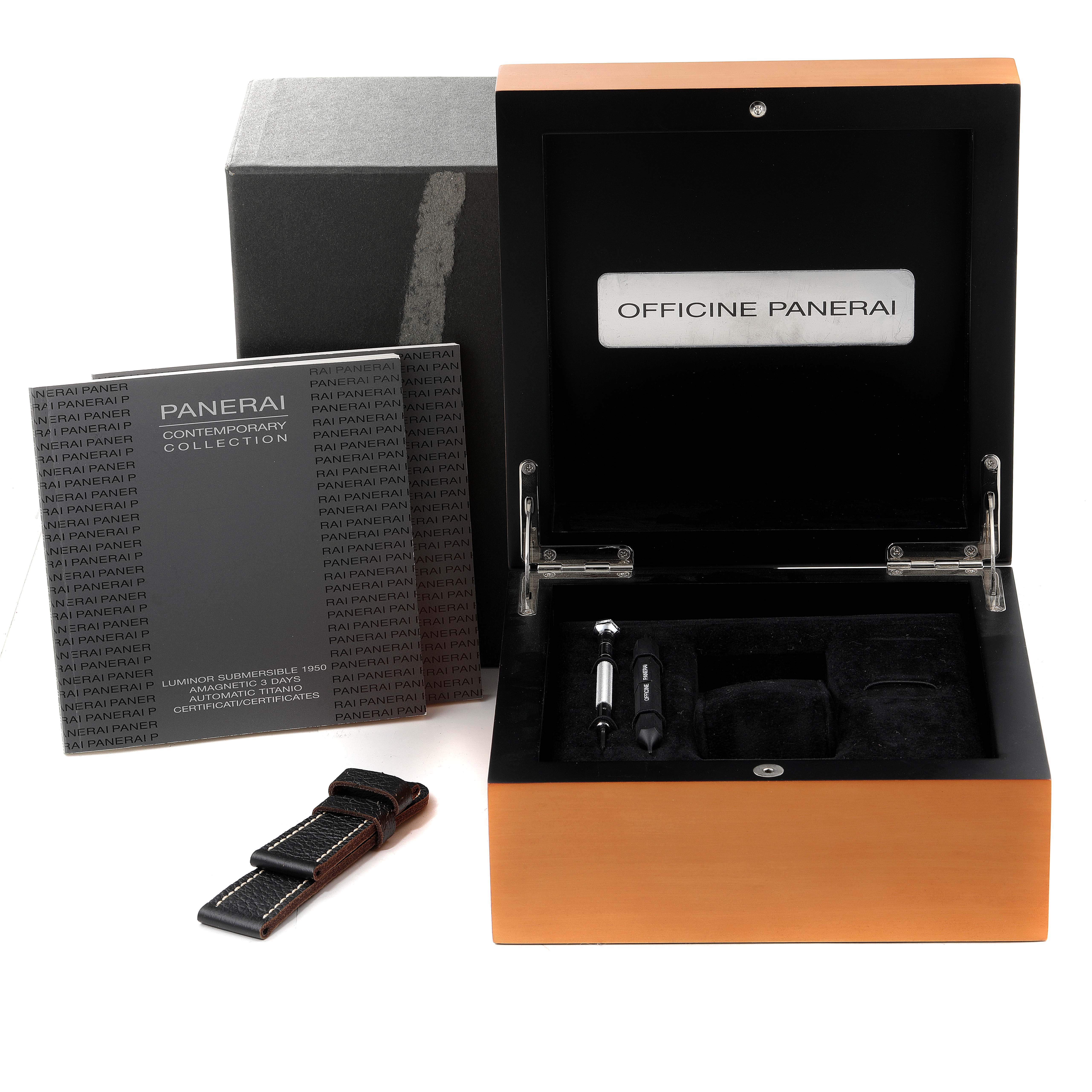 The image shows an open Panerai Submersible PAM00389 Men's Titanium Black Dial PAM00389 Men's Titanium Black Dial watch box with a strap, tools, and documentation.