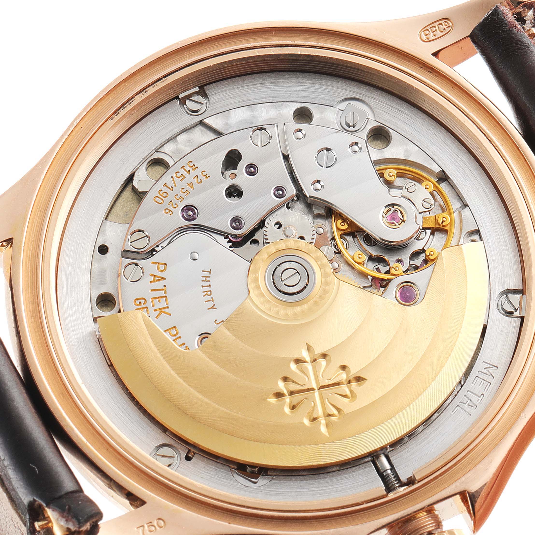 This image shows the back of a Patek Philippe Calatrava 5107R-001 Men
s Rose Gold Silver Dial 5107R-001 Men
s Rose Gold Silver Dial watch, highlighting its intricate mechanical movement and rotor.