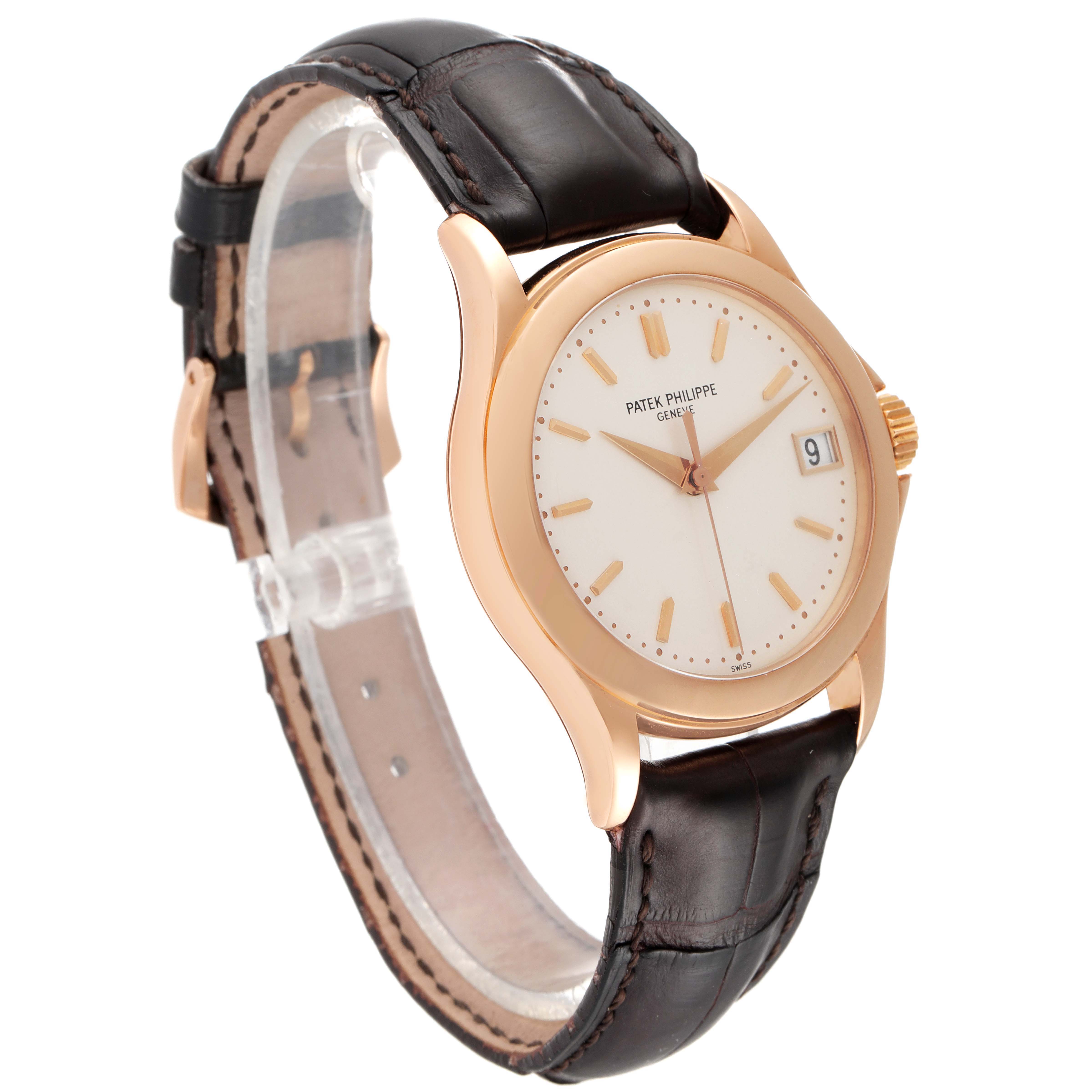 The image shows a Patek Philippe Calatrava 5107R-001 Men
s Rose Gold Silver Dial 5107R-001 Men
s Rose Gold Silver Dial watch at a slight angle, highlighting the watch face, leather strap, and crown.