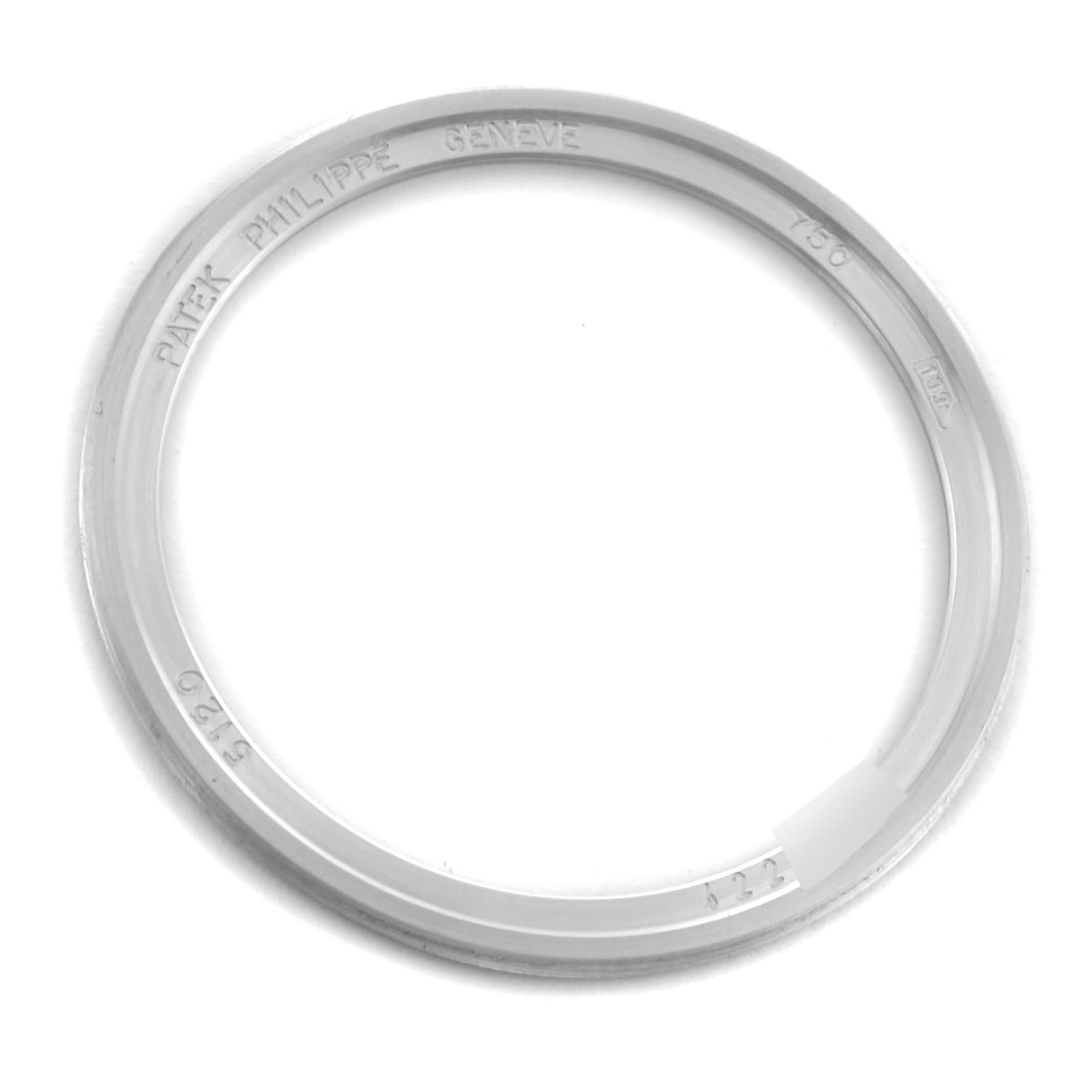 The image shows a top-down view of the bezel for a Patek Philippe Calatrava 5120G Men's White Gold White Dial 5120G Men's White Gold White Dial watch, featuring engraved details.