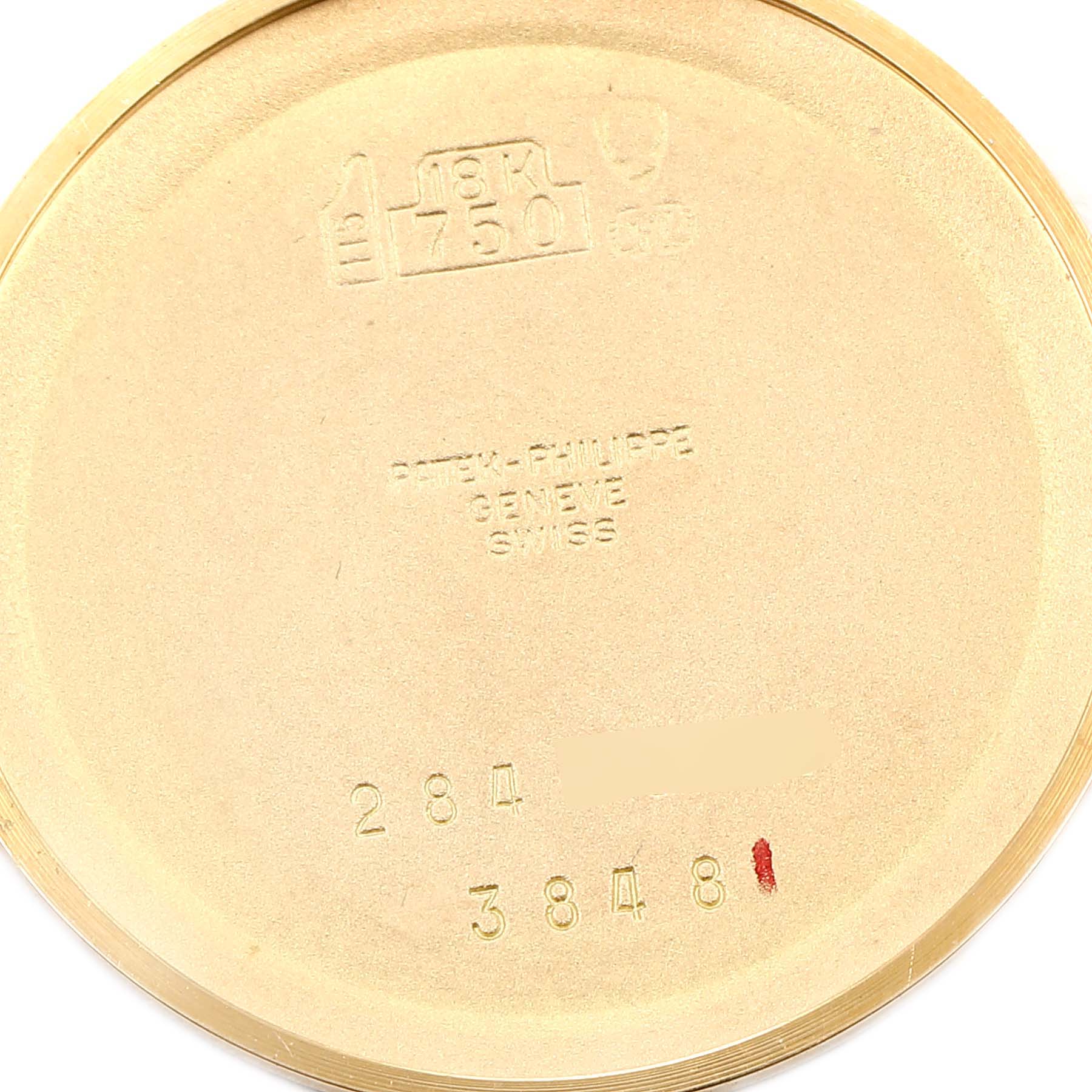 This image shows the interior case back of the Patek Philippe Golden Ellipse 3848 Men's Yellow Gold Blue Dial 3848 Men's Yellow Gold Blue Dial watch, highlighting engravings and hallmarks.