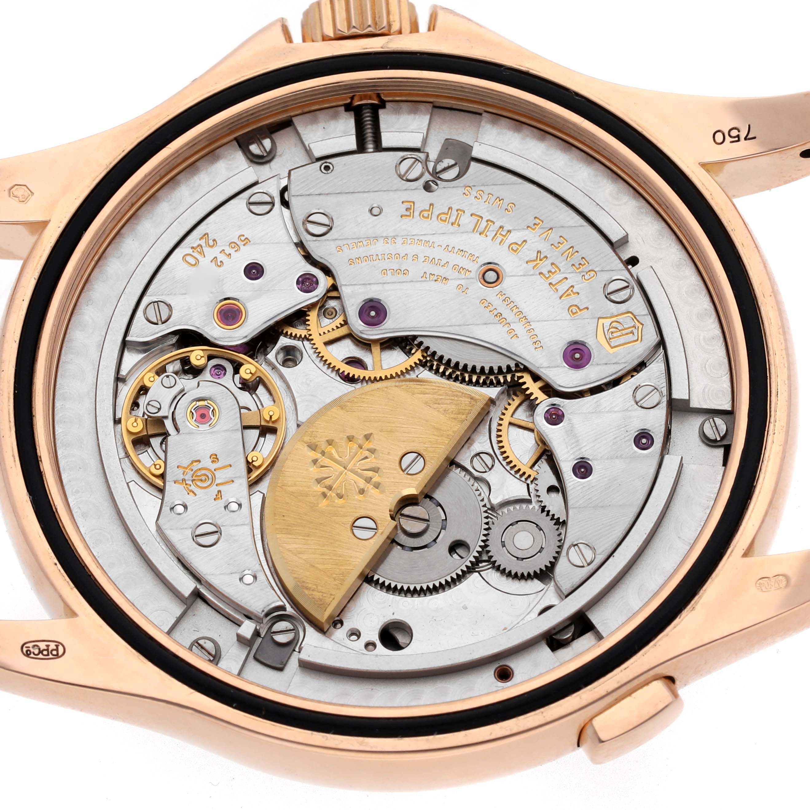 The image shows the back view of a Patek Philippe Complications 5130R-018 Men
s Rose Gold Silver Dial 5130R-018 Men
s Rose Gold Silver Dial watch, highlighting its intricate movement and rotor.