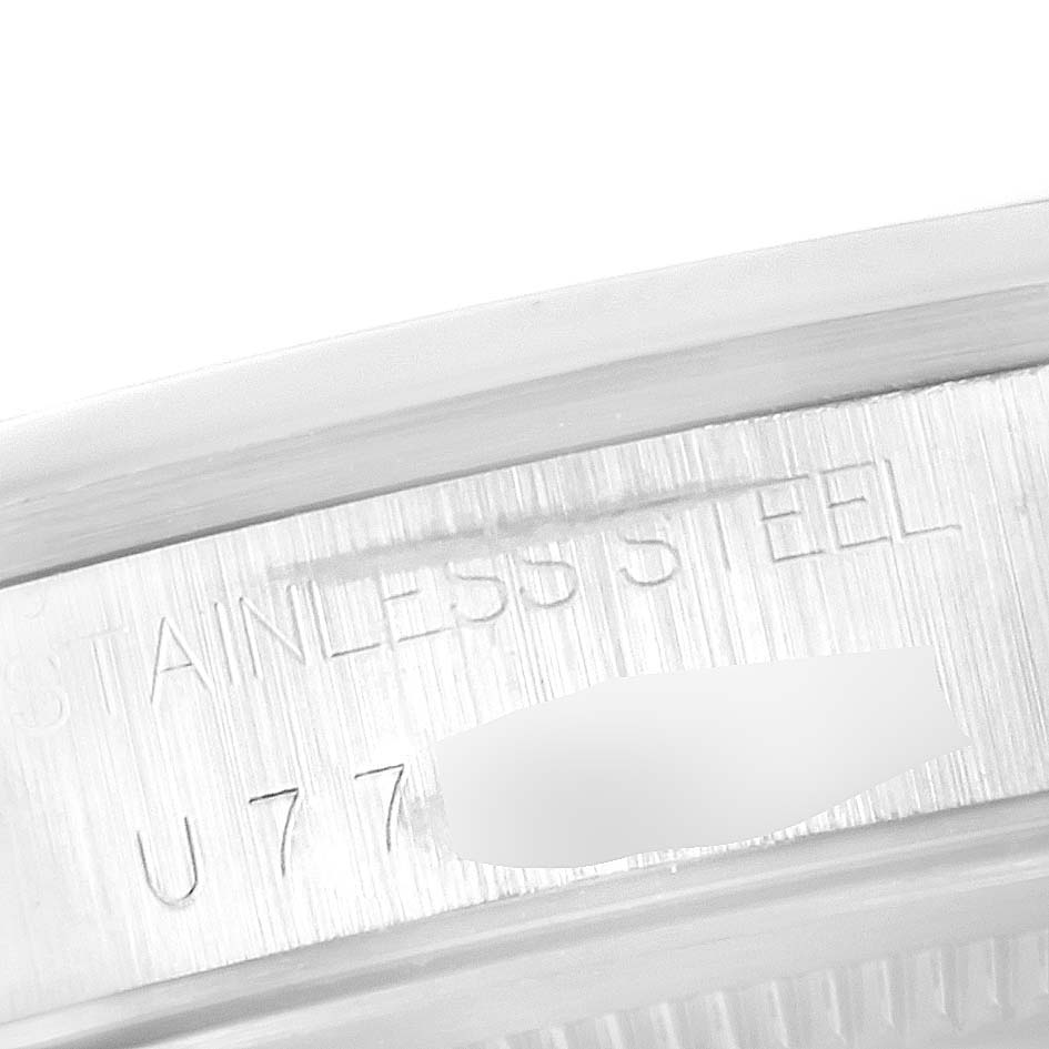 This close-up image shows the engraved stainless steel of a Rolex Air-King 14000 Men's Stainless Steel Blue Dial 14000 Men's Stainless Steel Blue Dial watch, featuring part of the serial number.
